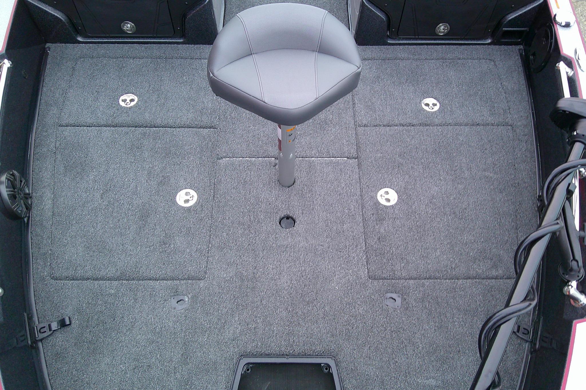 Interior of 2026 Nitro ZV20 Pro boat with gray carpet and swivel seat.