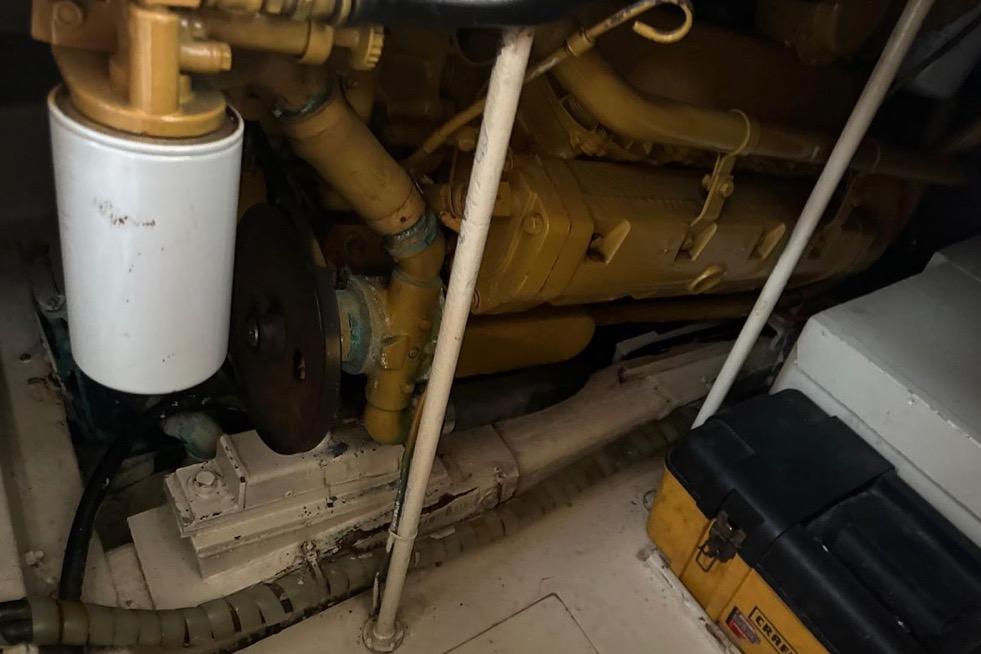 Engine compartment of a 1985 Egg Harbor 33 Sedan boat, showcasing mechanical components.