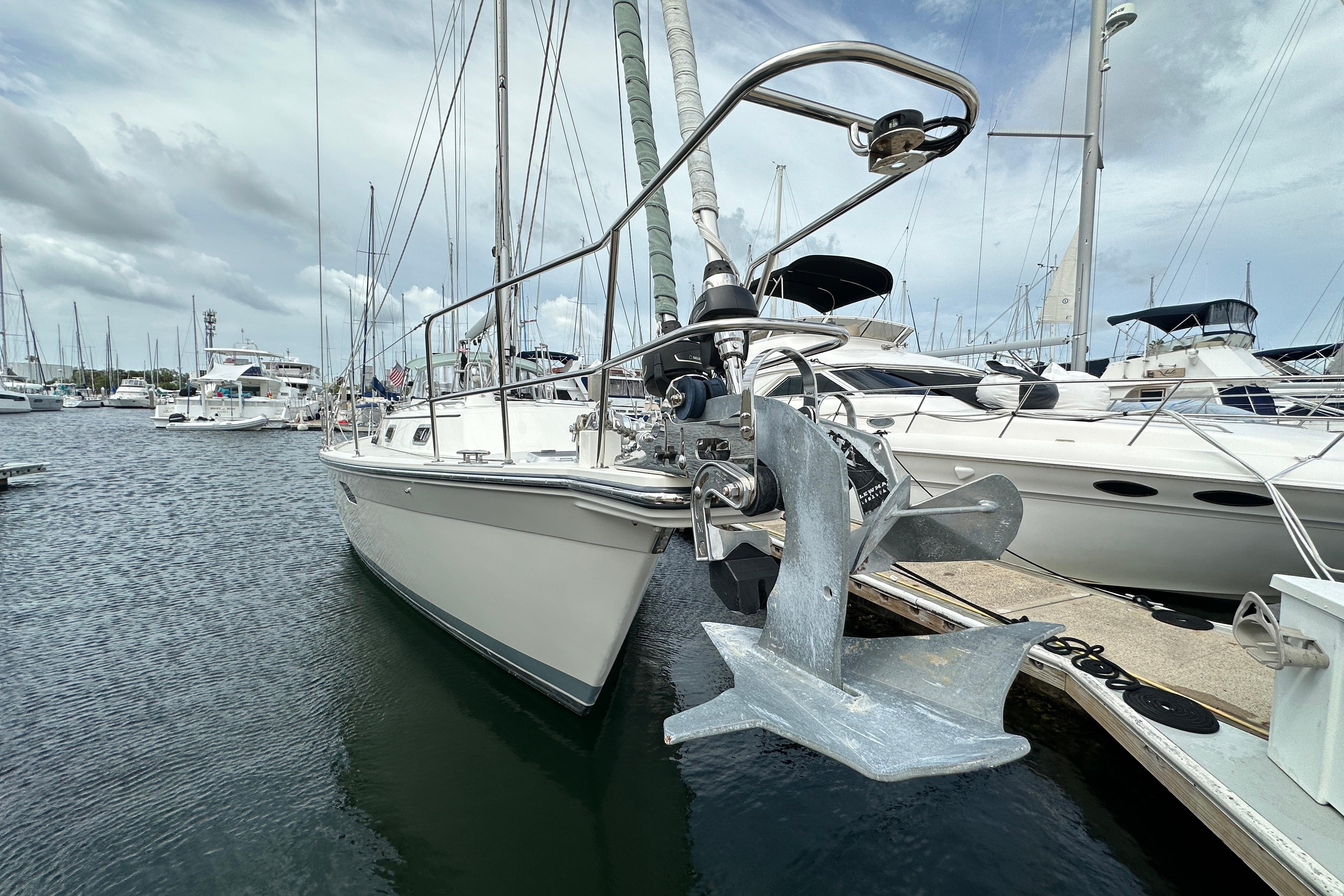 2023 Island Packet 439 sailboat docked in a marina, featuring a prominent anchor.