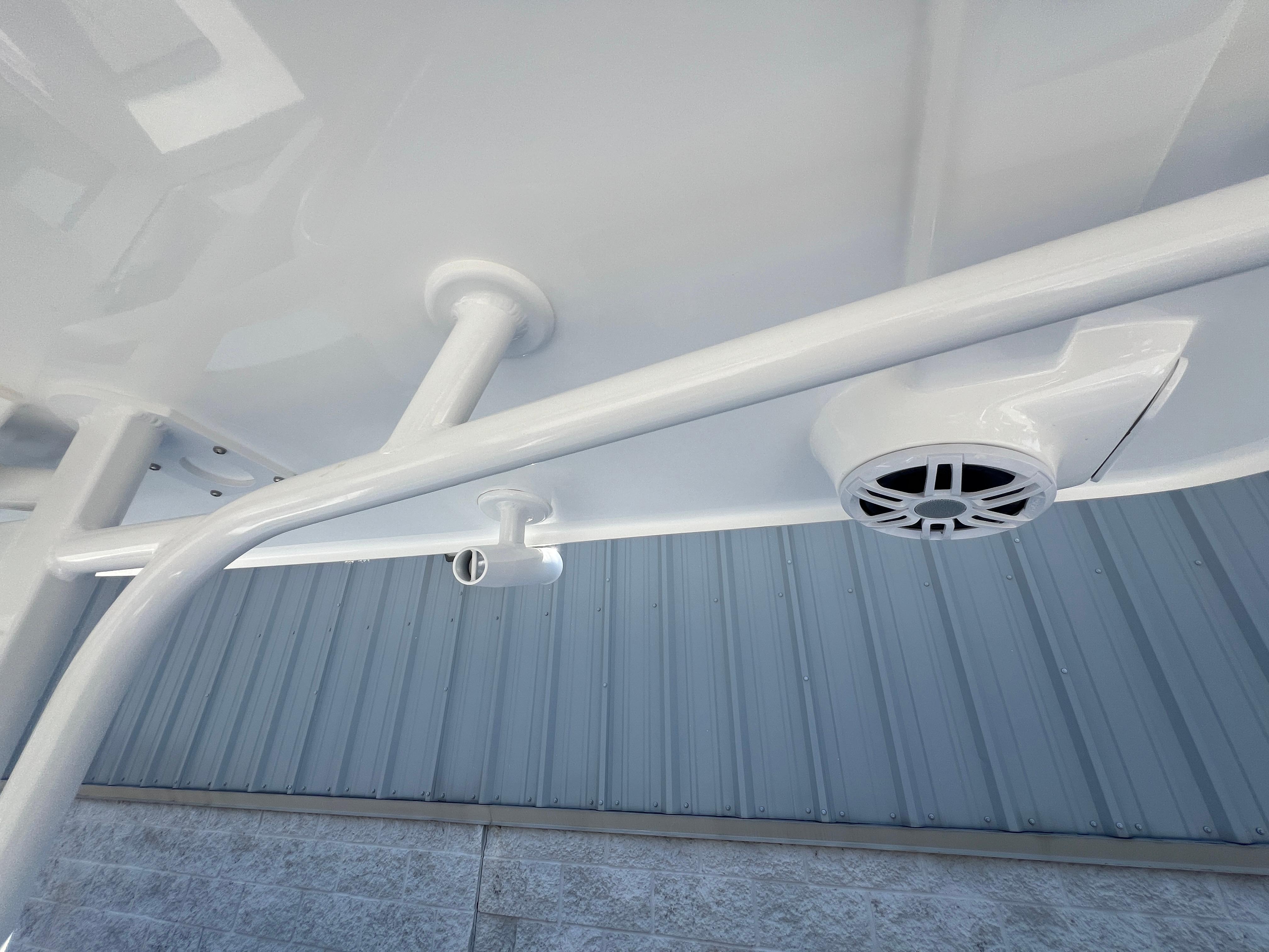 2025 NauticStar 252L boat underside with speaker and rod holder.