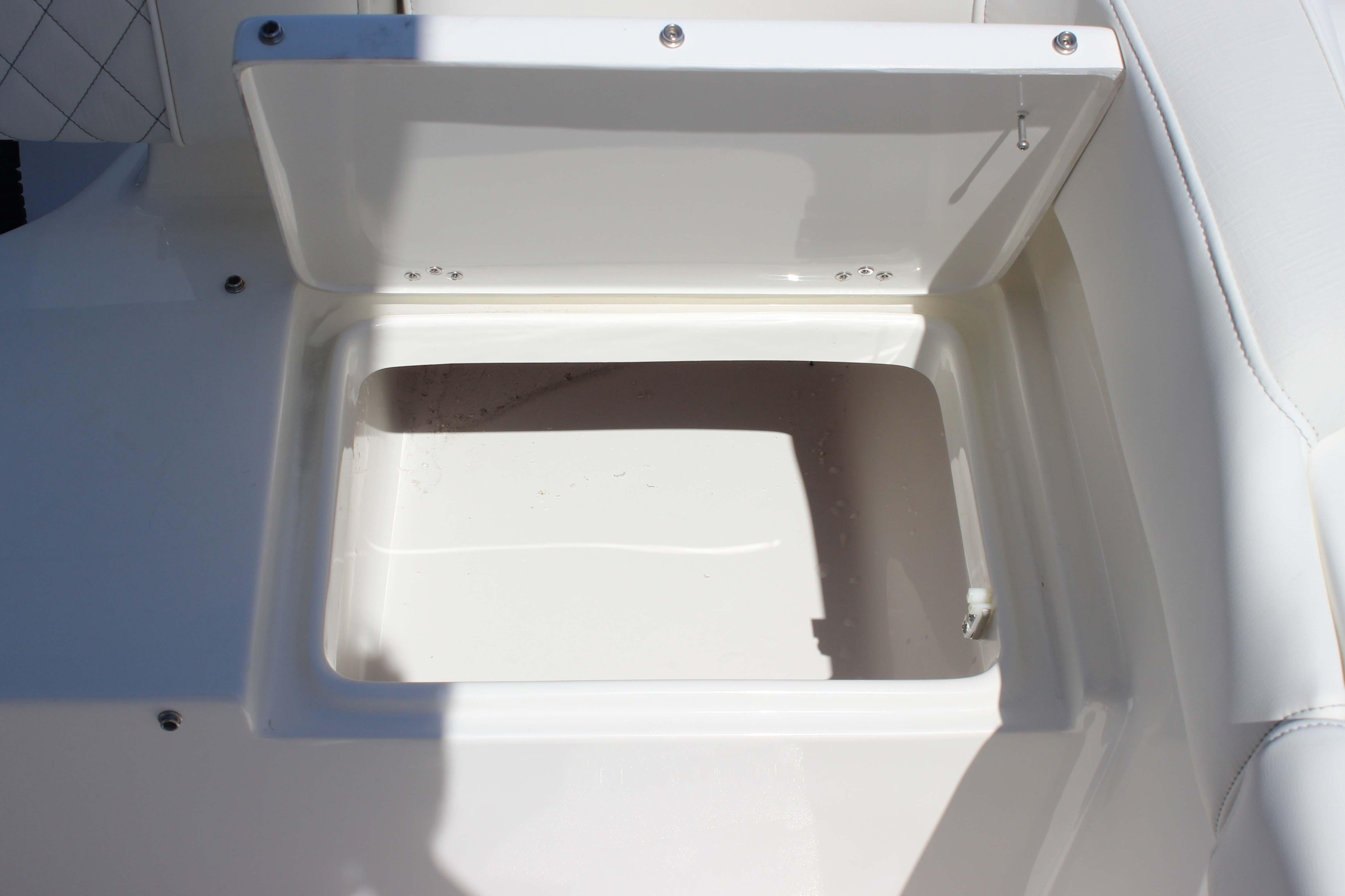 Open storage compartment on 2026 Key West 203 FS boat.