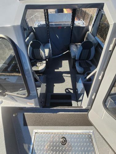 Interior of 2025 Spartan 200 Astoria boat with seating and modern design.