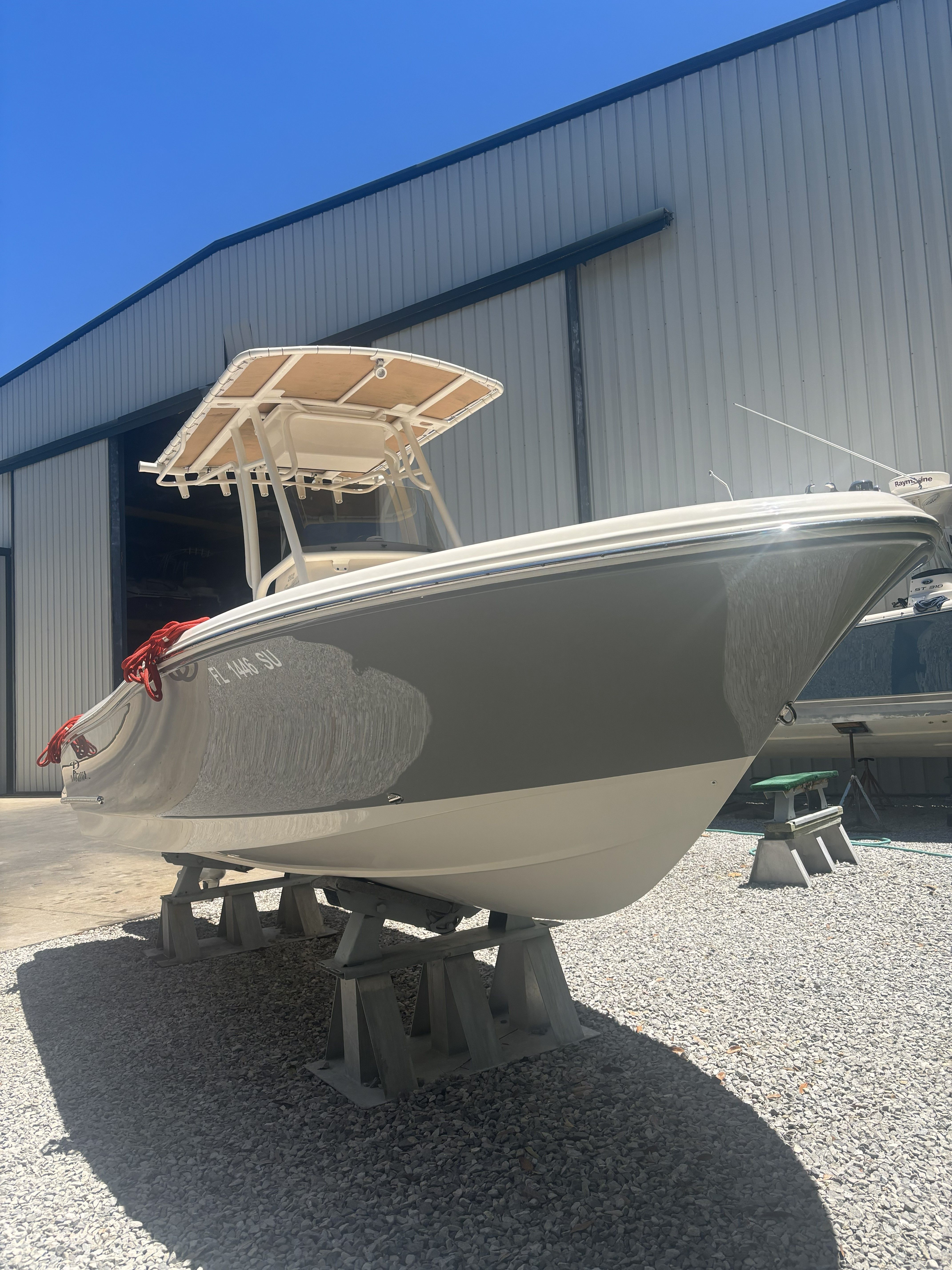 2020 Pioneer 202 Sportfish boat outside warehouse.