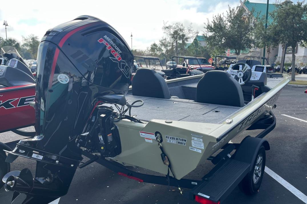 2026 Tracker Pro Team 190 boat with Mercury Pro XS engine in a parking lot.