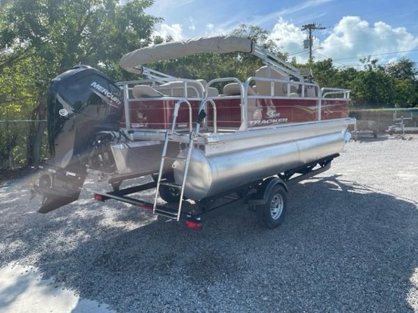 2024 Sun Tracker Bass Buggy 18 DLX pontoon boat with Mercury outboard engine.