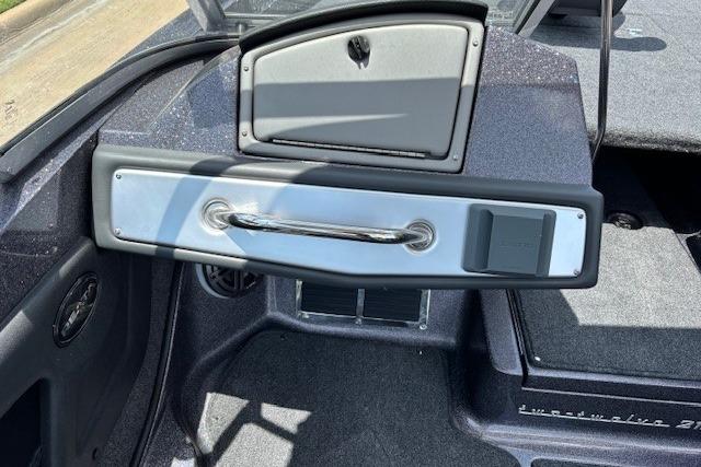 Interior view of a 2026 Ranger 212LS boat dashboard with storage compartment.