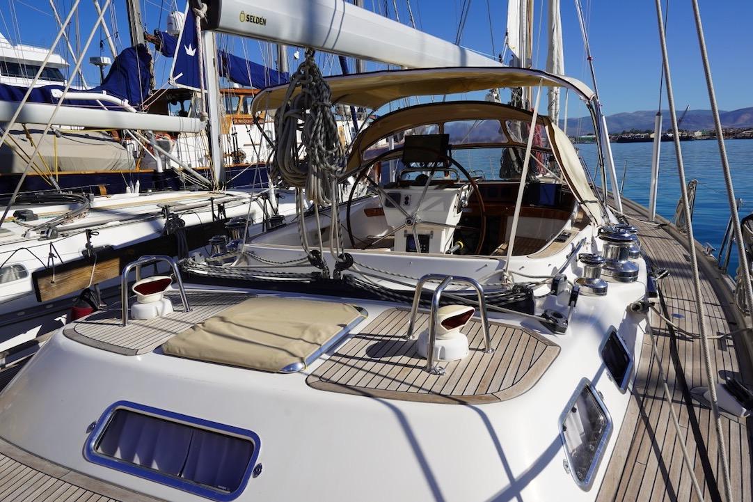 2010 Najad 511 yacht with teak deck and cockpit, docked in a marina.