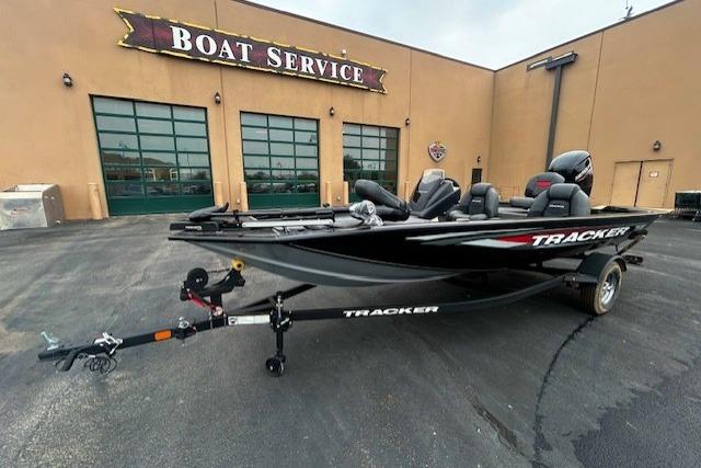 2026 Tracker Pro Team 175 boat parked outside a boat service center.