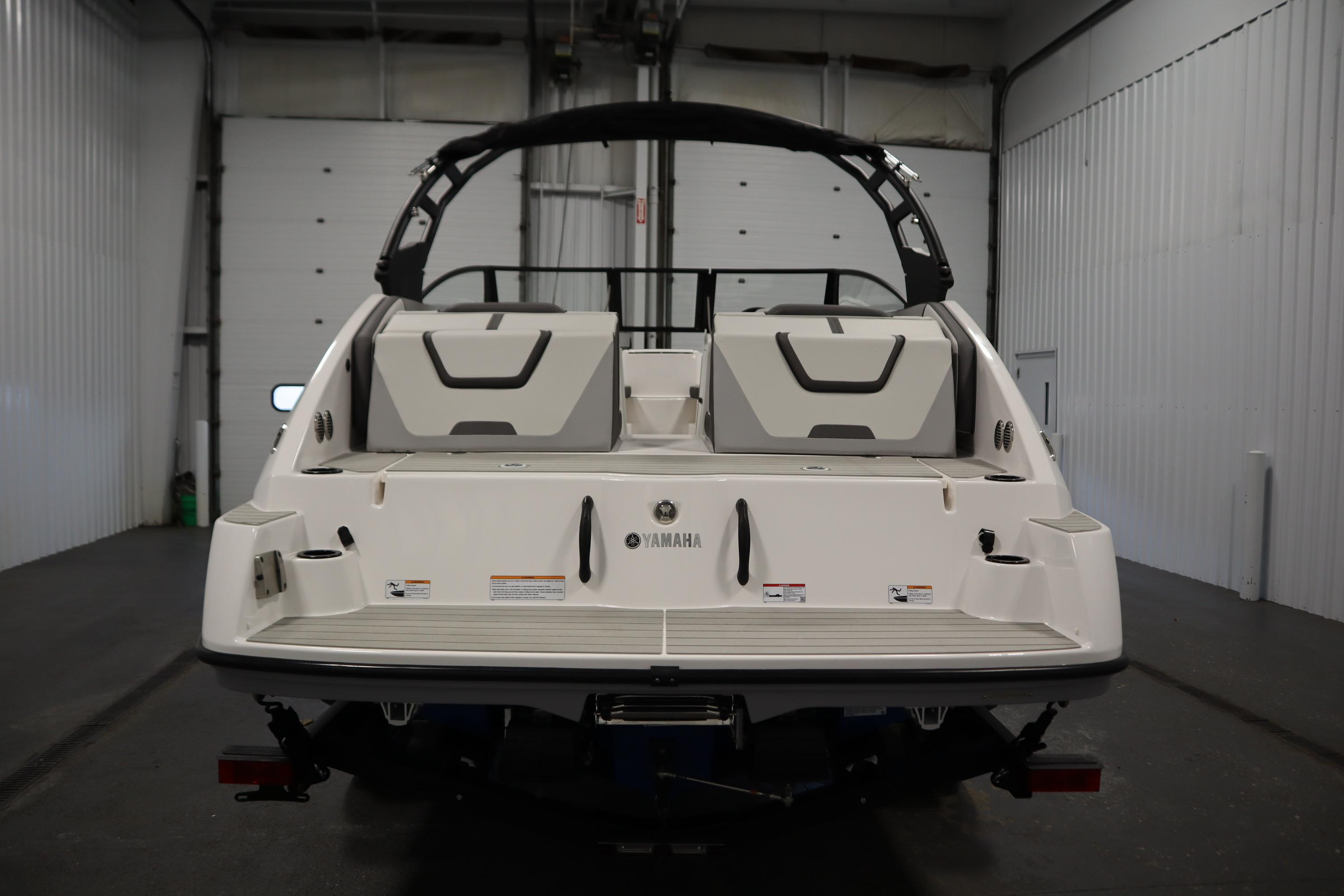 2026 Yamaha Boats AR220, rear view in a garage setting.