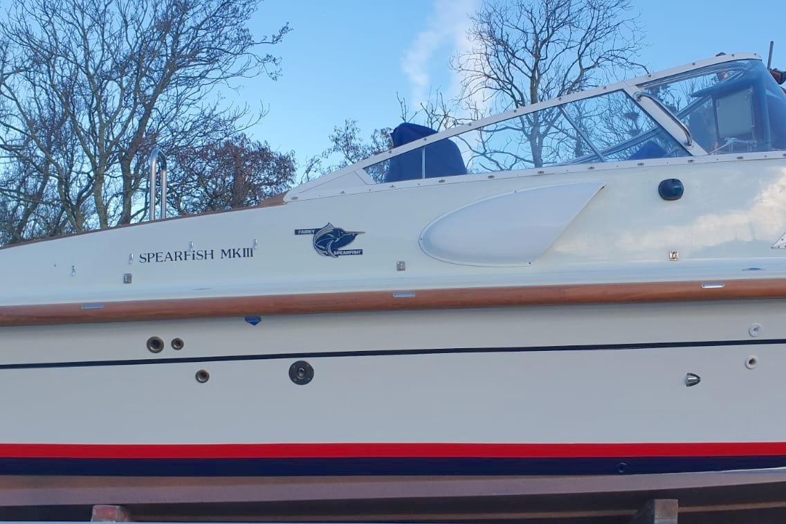 1989 Fairey Spearfish MKIII boat with sleek design and clear blue sky background.