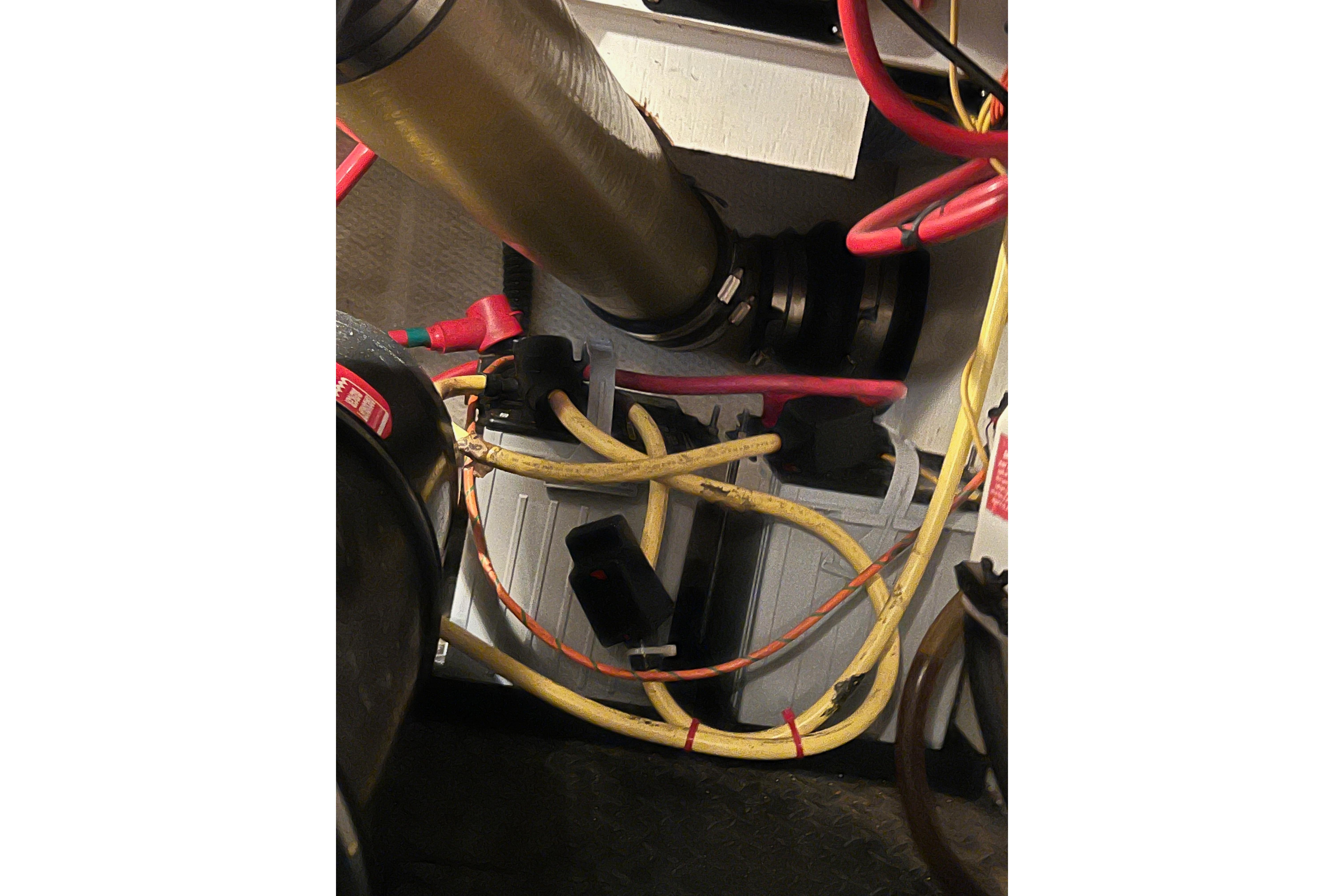 Engine compartment of a 2006 Silverton 38 Sport Bridge with visible wiring and components.