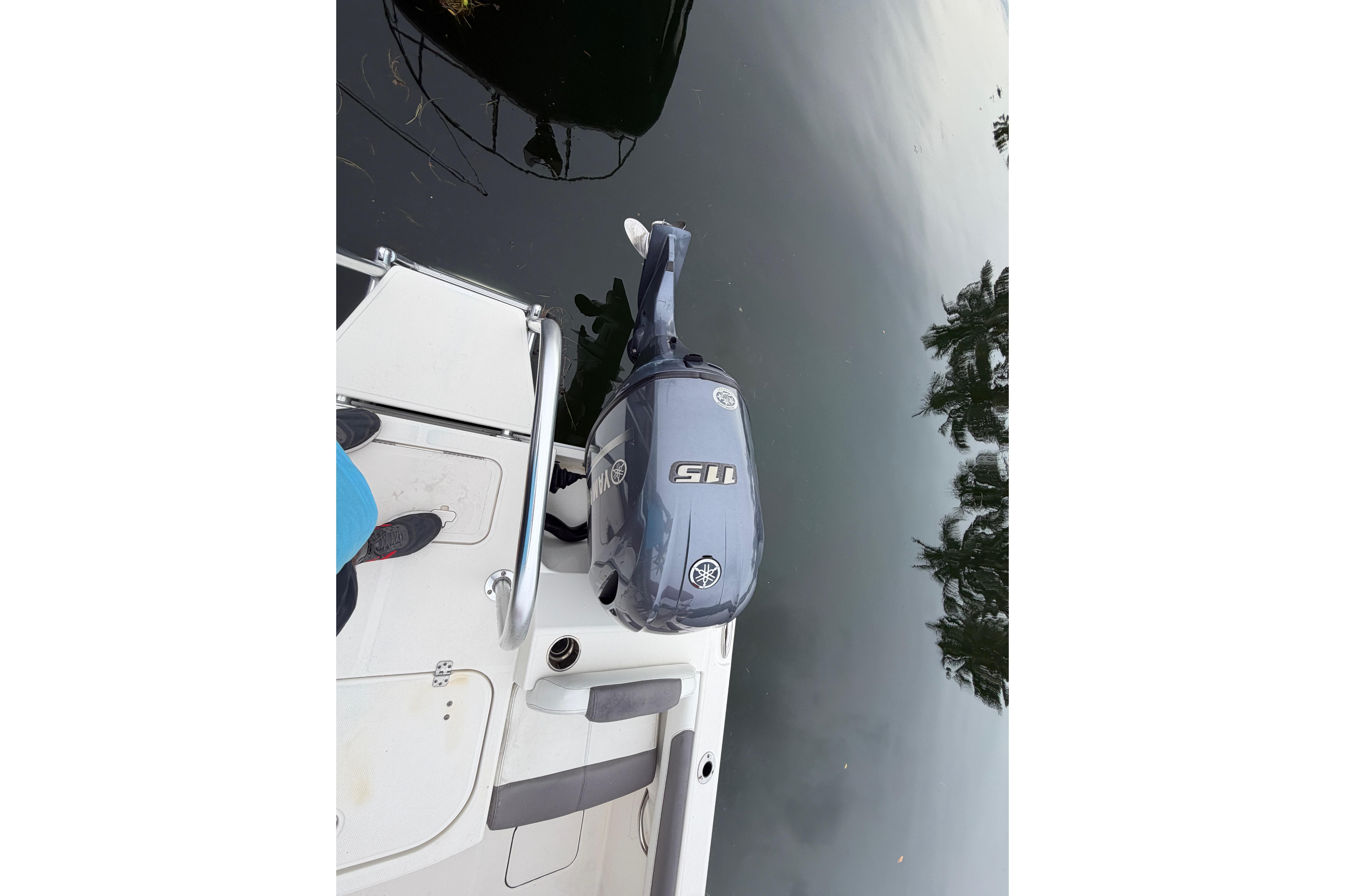 2019 World Cat 230 DC boat with Yamaha 115 outboard motor on calm water.