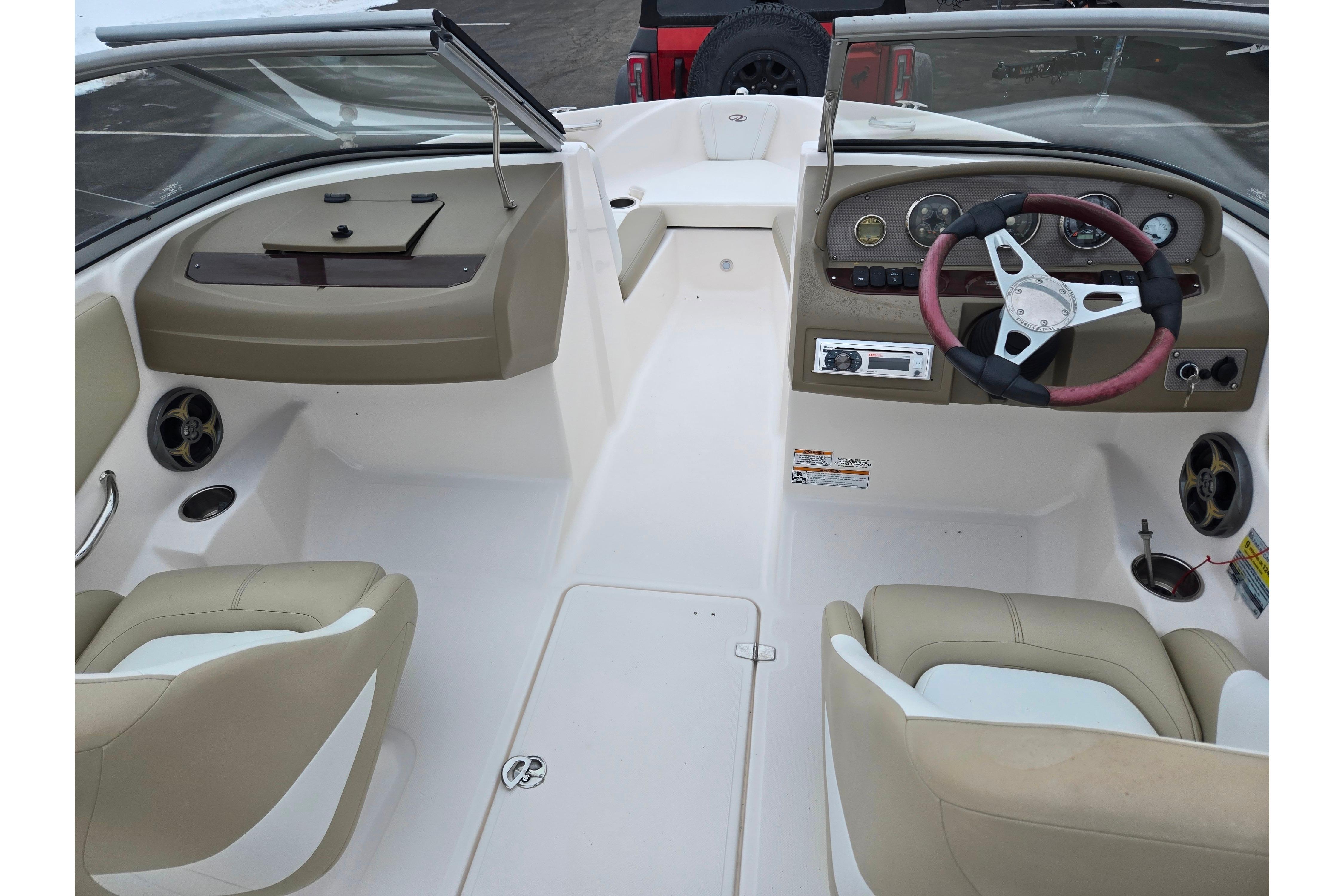 2015 Regal 1900 ES Bowrider interior with beige seating and steering wheel.