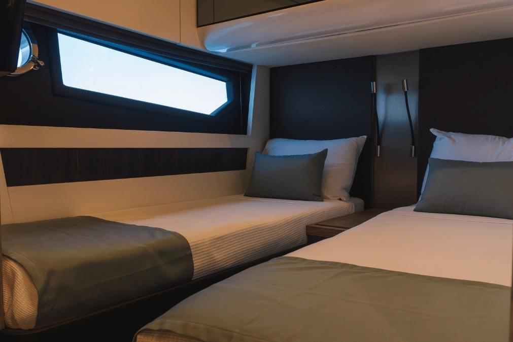 Luxurious twin cabin interior of 2020 Azimut 60 yacht with modern design.