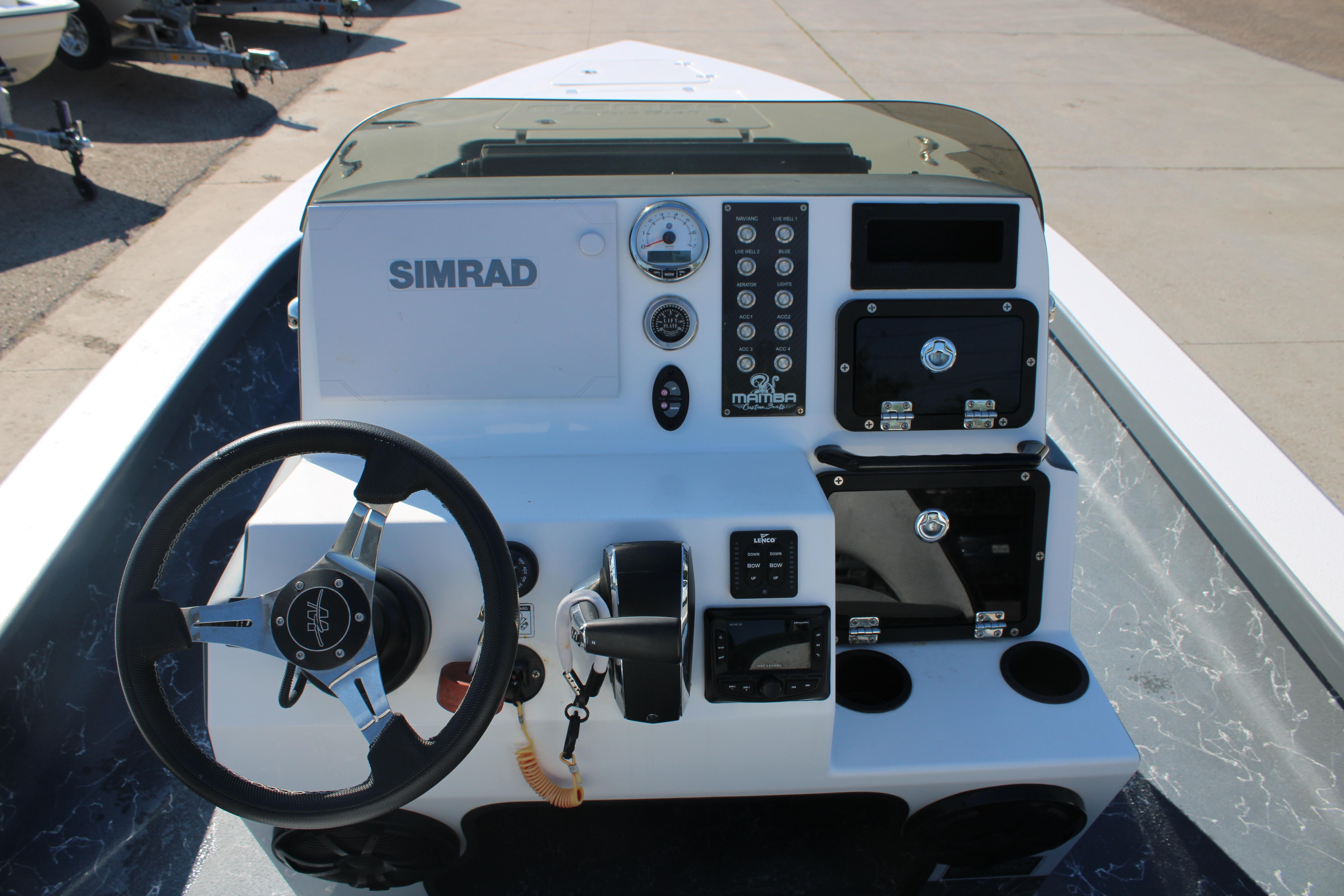 2023 Mamba 24VX boat console with Simrad electronics and steering wheel.