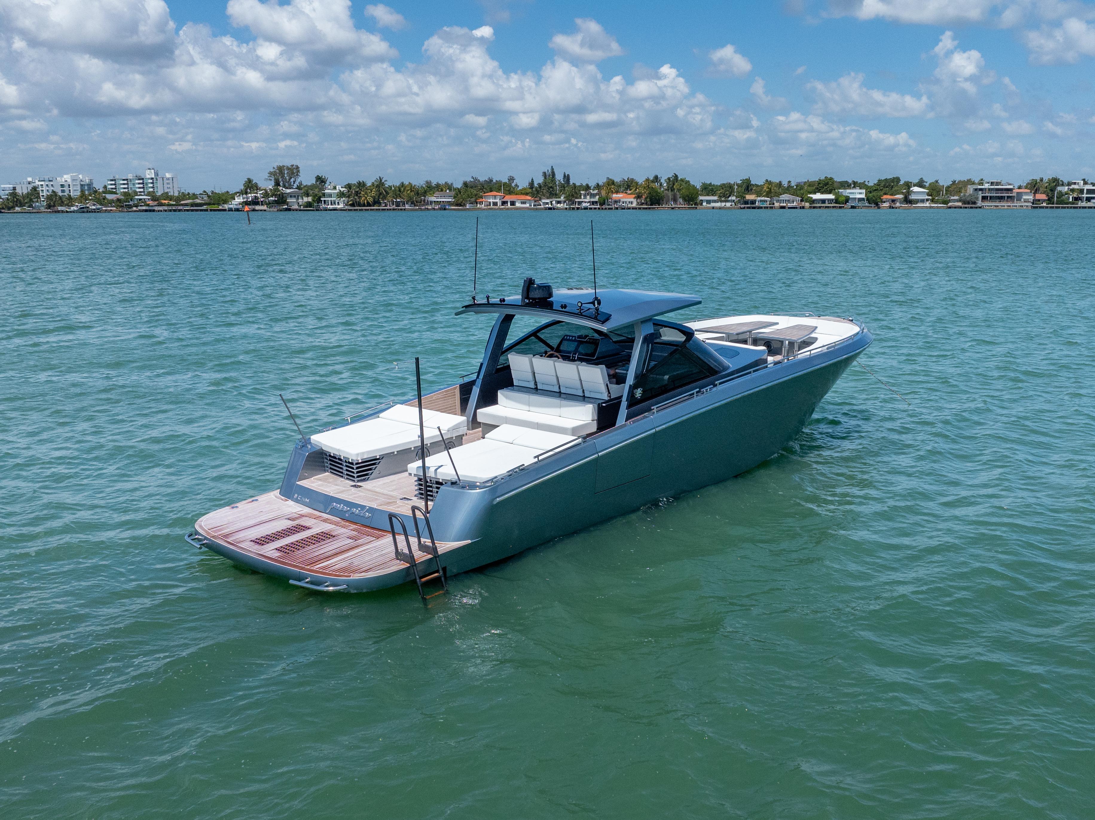 2024 CNM CONTINENTAL 54 SuperSport yacht on calm water under blue sky.