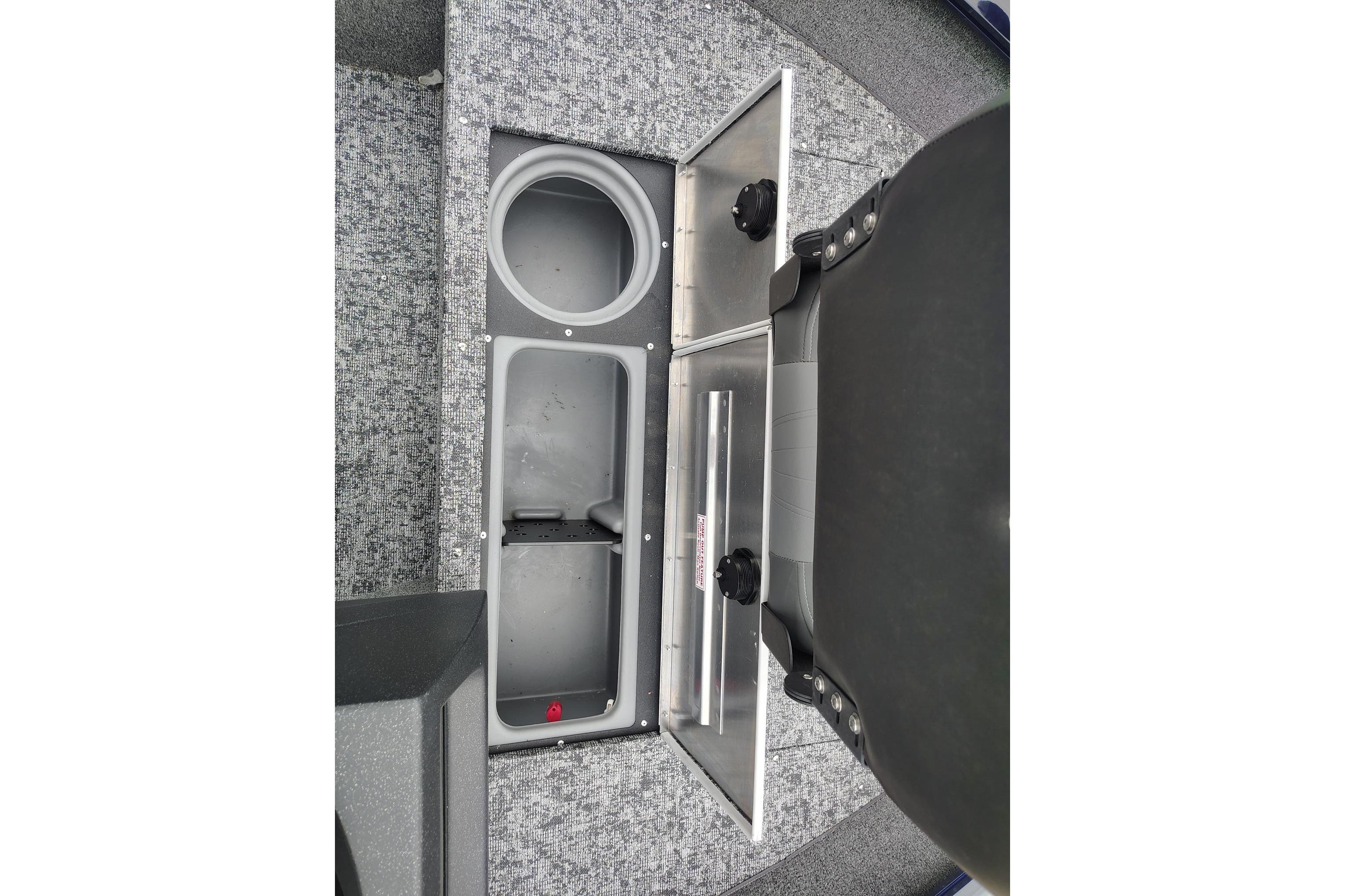 2026 Tracker Pro Guide V-16 SC boat storage compartments with open lids.