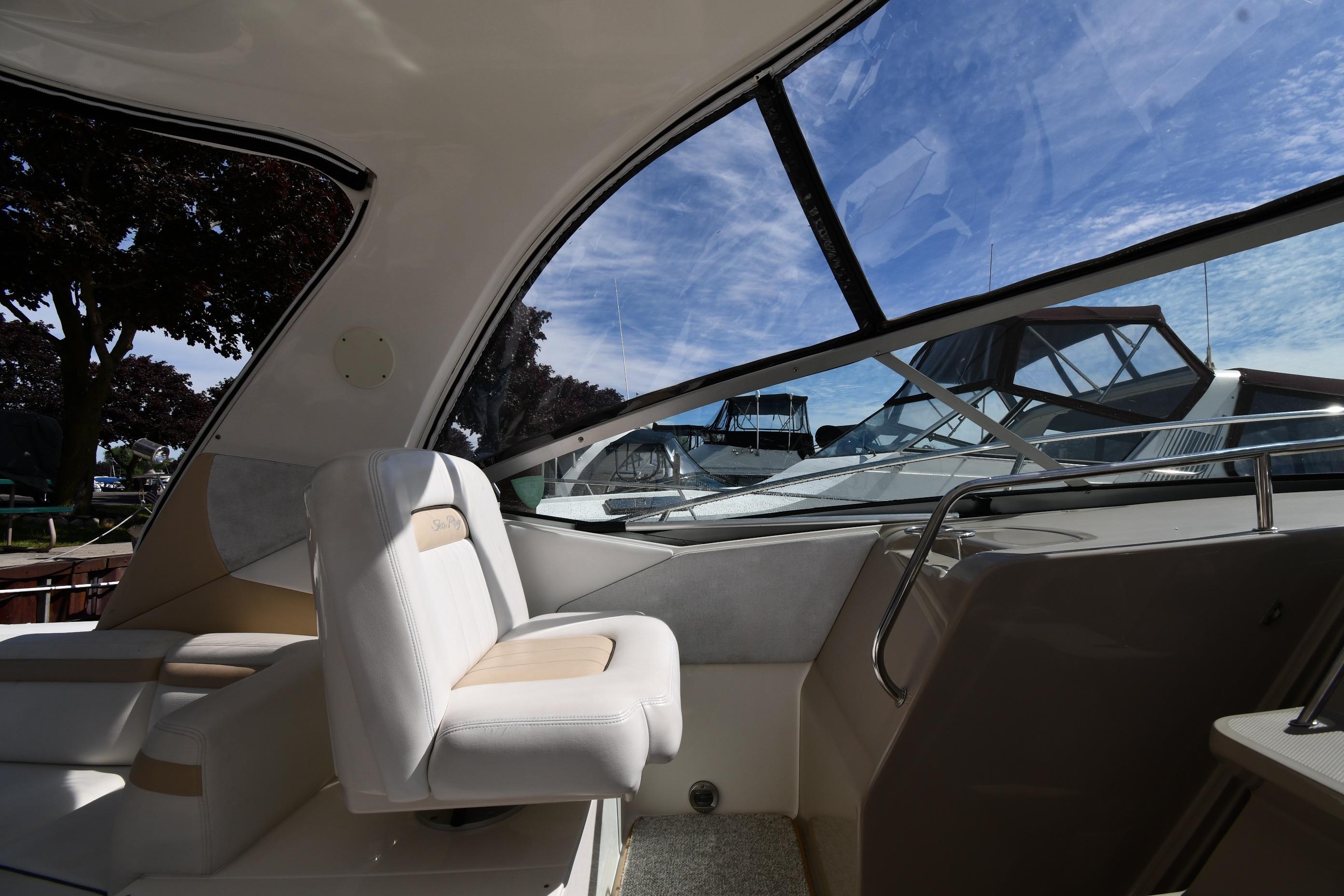 Interior view of 2008 Sea Ray Sundancer 350 yacht with plush seating and large windows.