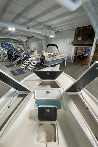 2024 Key West 250 Bay Reef boat on display in a showroom.
