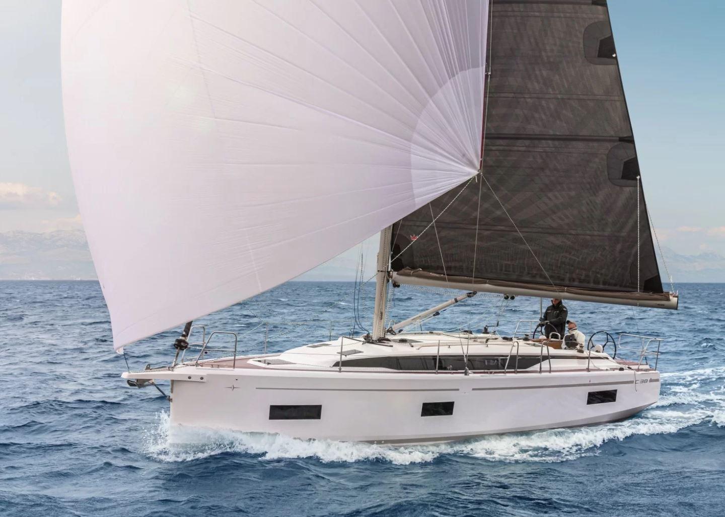 2023 Bavaria C 38 yacht sailing on open sea with white and black sails.