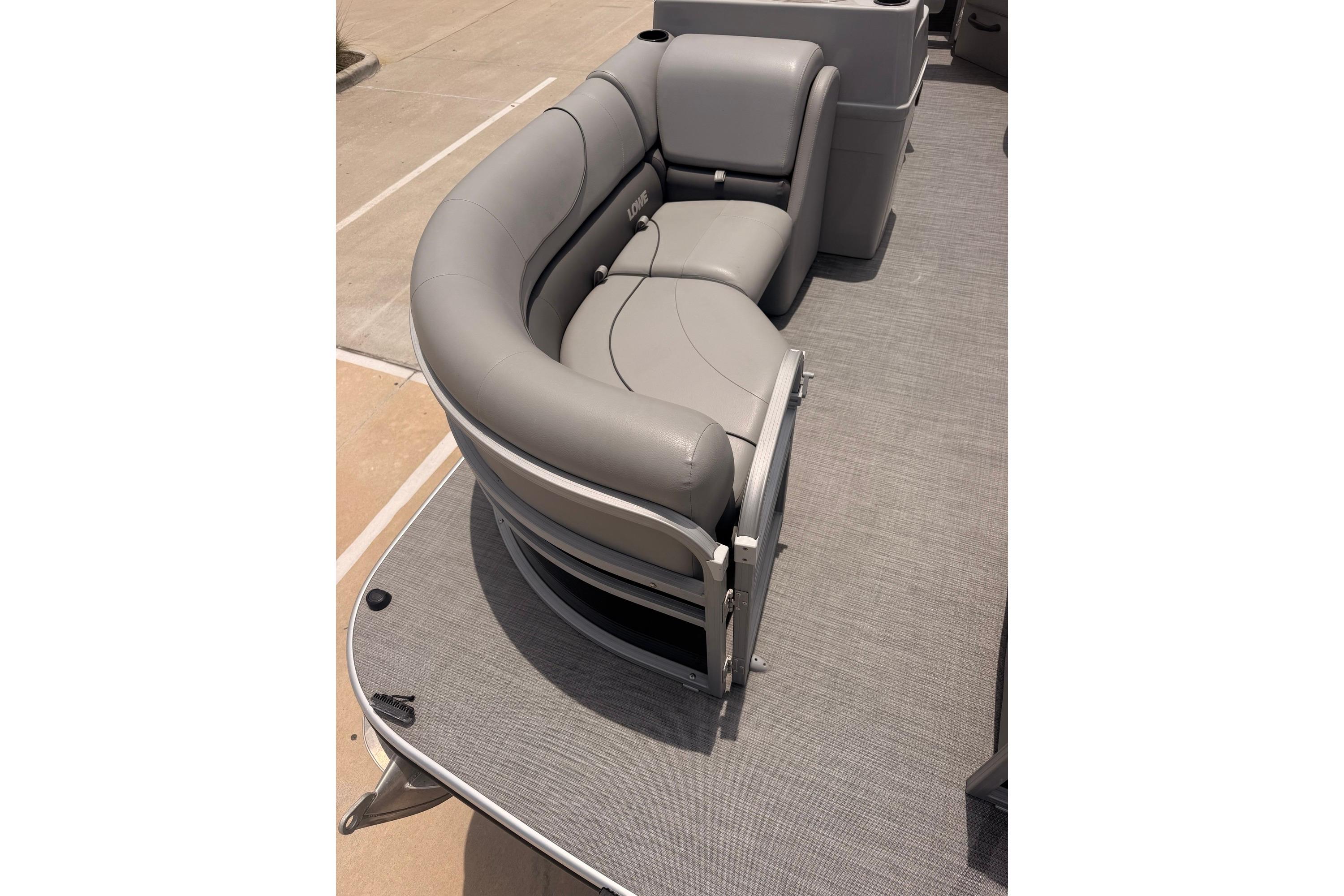 Gray seating on a 2021 Lowe SS 210 pontoon boat deck.