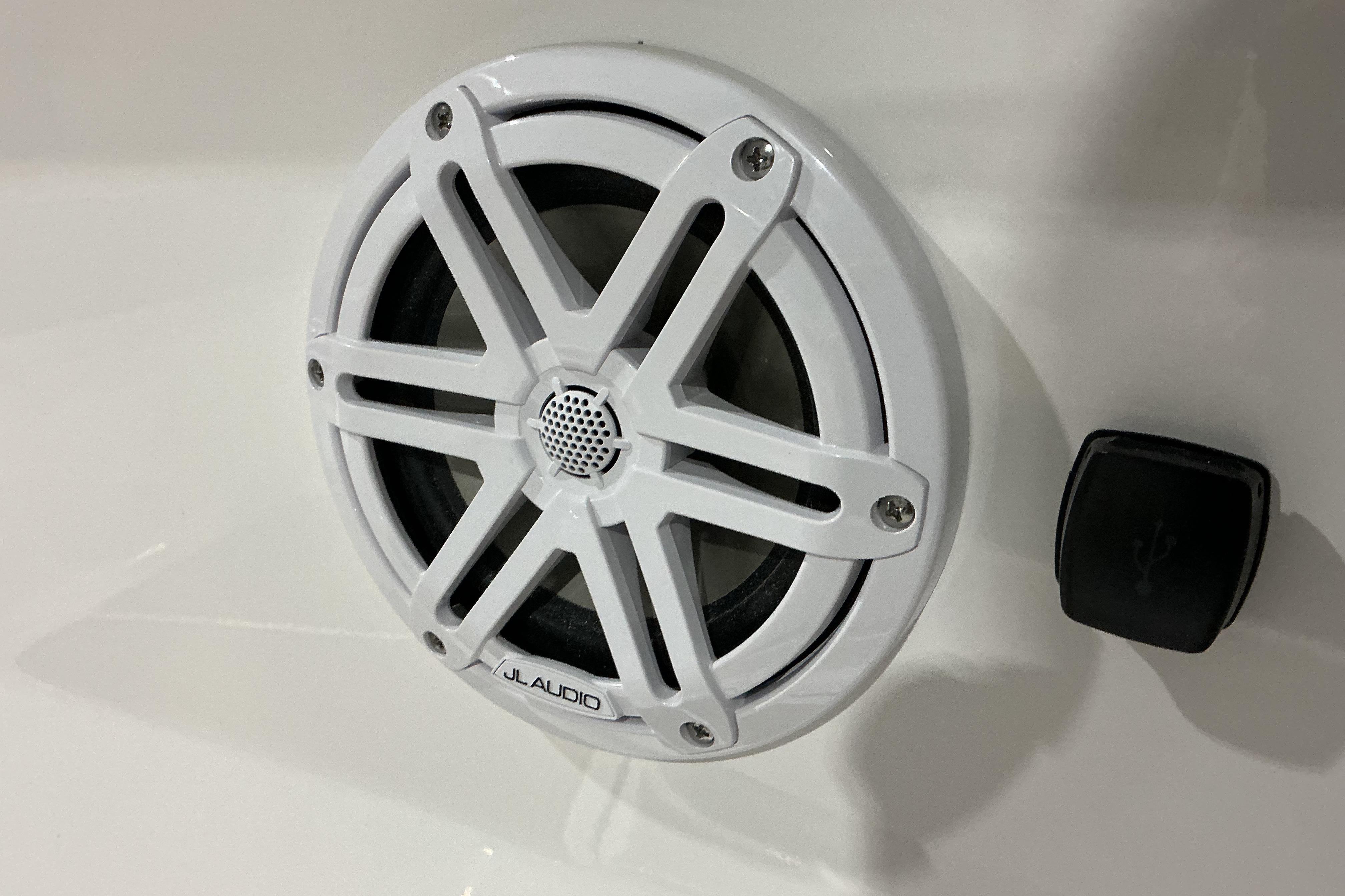 White JL Audio speaker on 2026 Monterey Elite 25 OB boat interior.