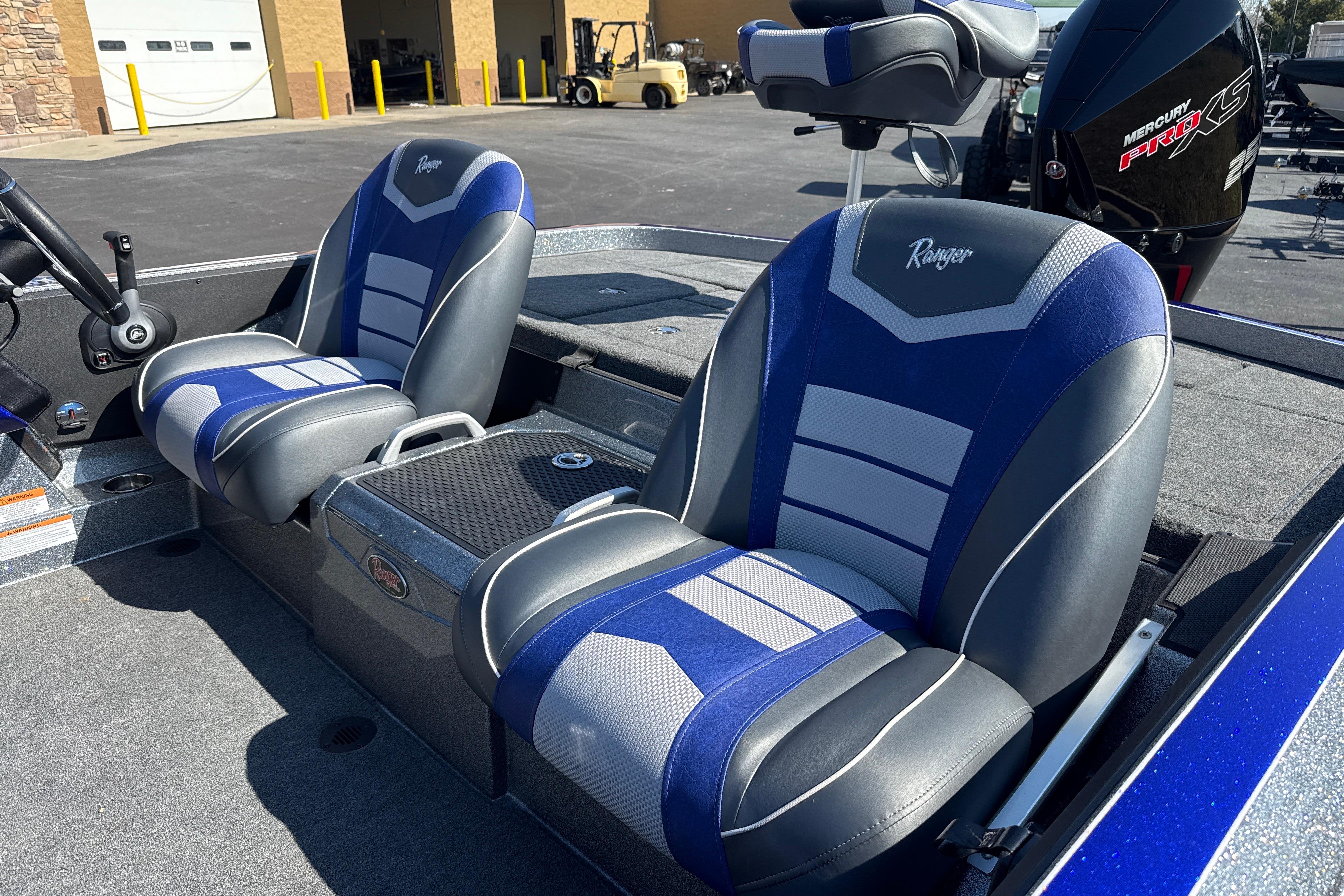 2026 Ranger Z521 boat seats with blue and gray design, parked outdoors.