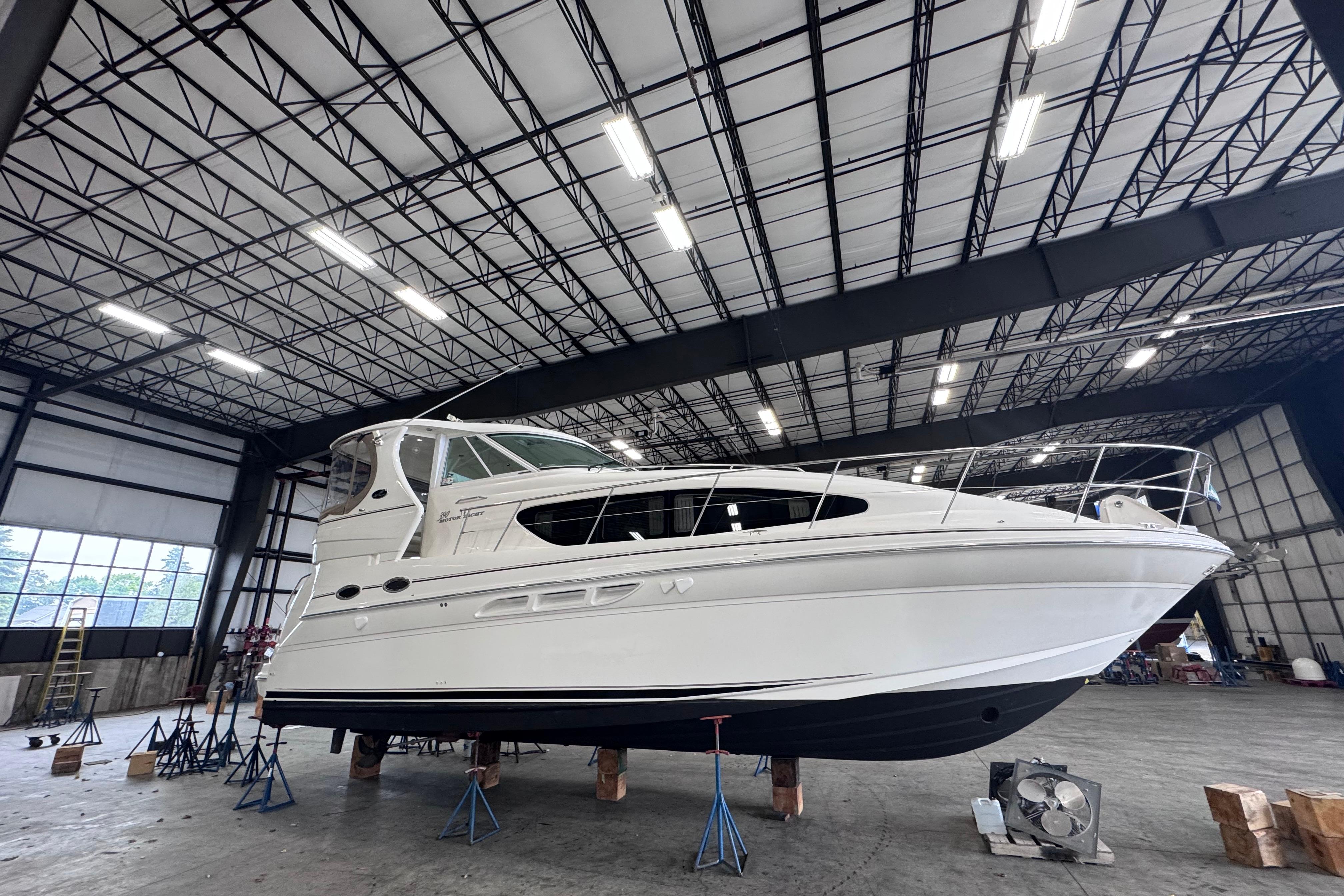 2004 Sea Ray 390 Motor Yacht in a spacious indoor storage facility.