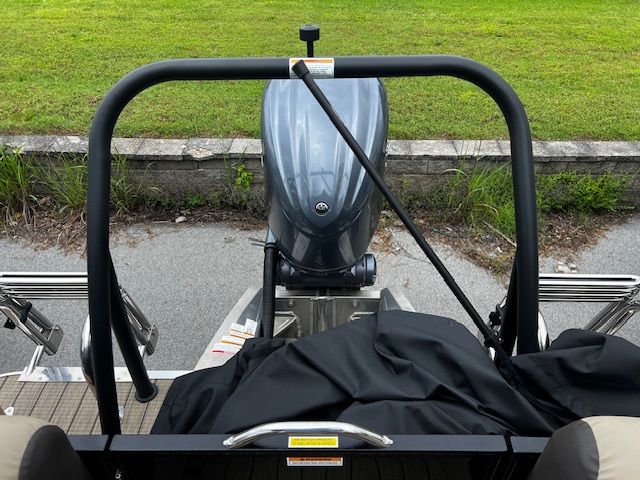 Rear view of a 2023 Veranda VP22RCT pontoon boat with motor.
