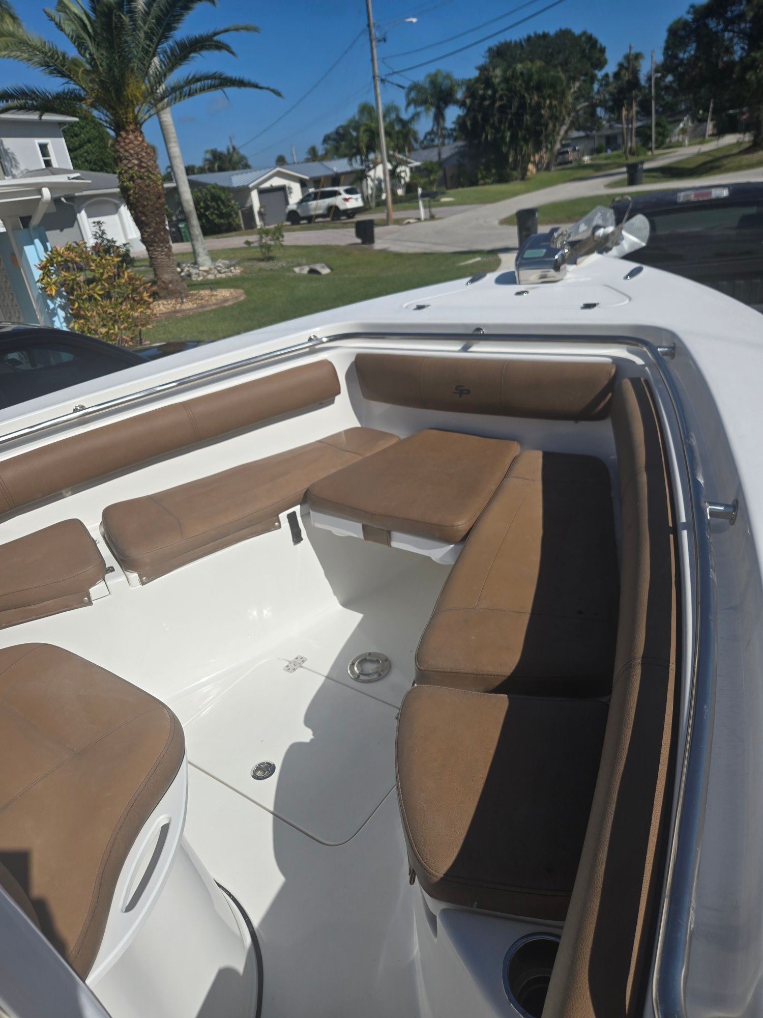 Interior view of a 2018 Sea Pro 21.9 boat with brown seating.
