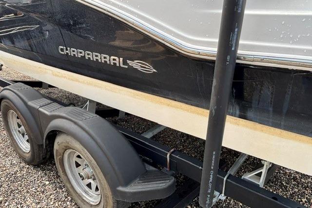 Chaparral 21 SSi 2021 boat on trailer, side view with logo visible.