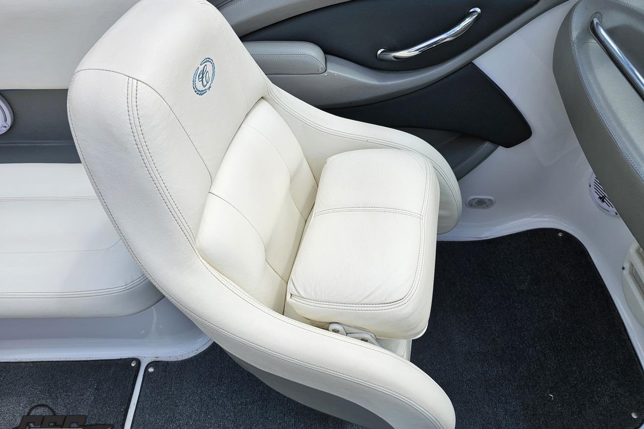 White leather seat in a 2010 Cobalt 232 WSS boat interior.