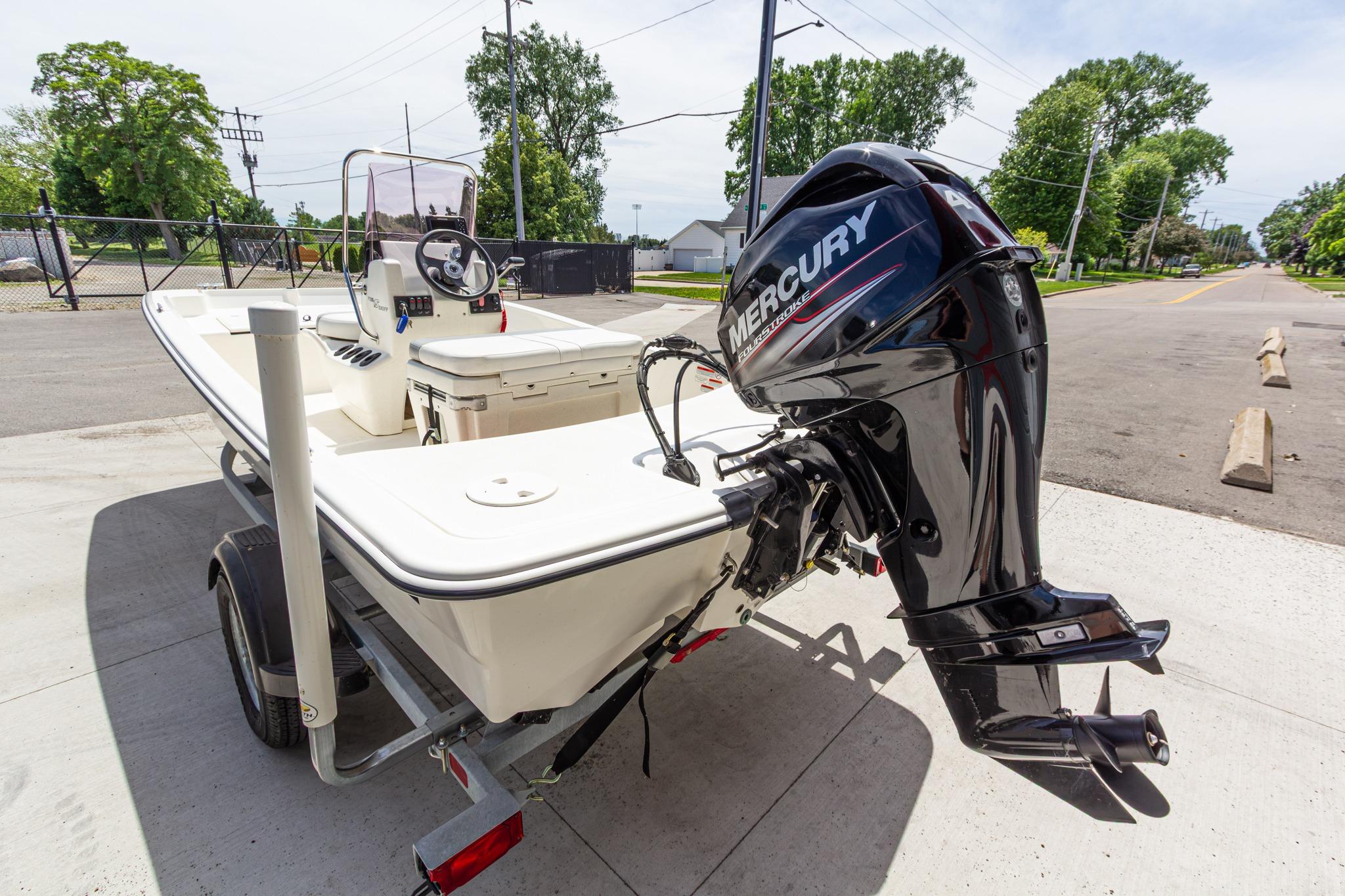 2020 Mako Pro Skiff 15 CC boat with Mercury outboard motor on trailer.