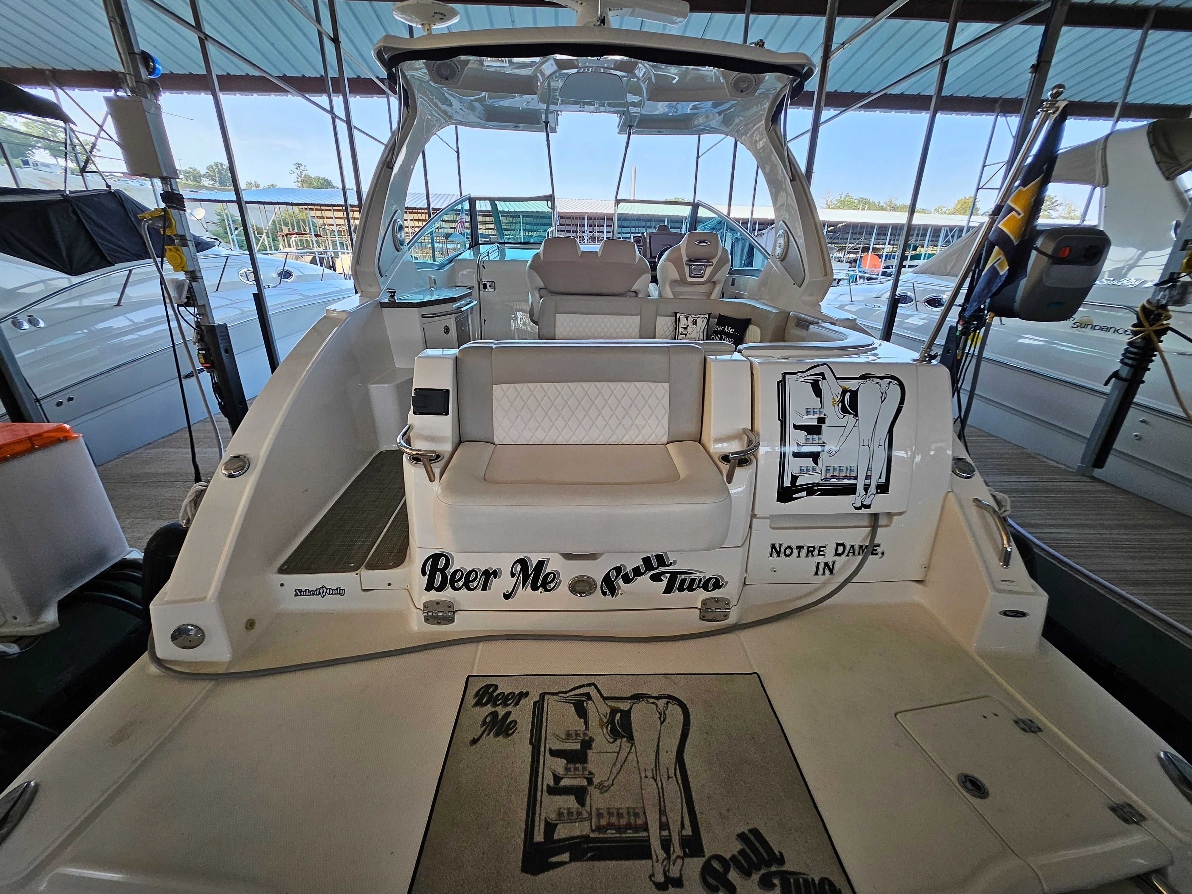 2014 Chaparral 330 Signature yacht docked with unique design.