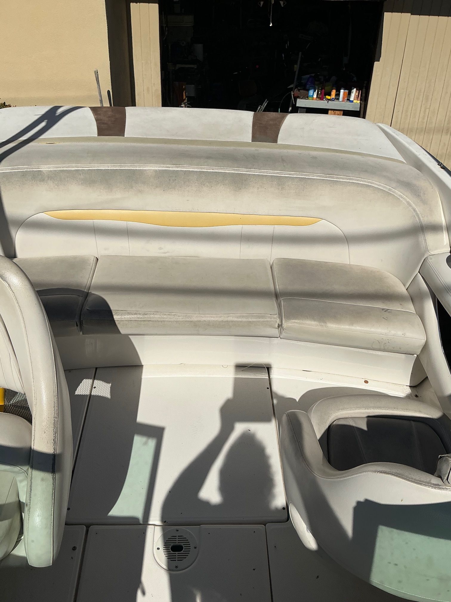 The image shows the cockpit of a 2003 Chaparral 210 SS with white seating.