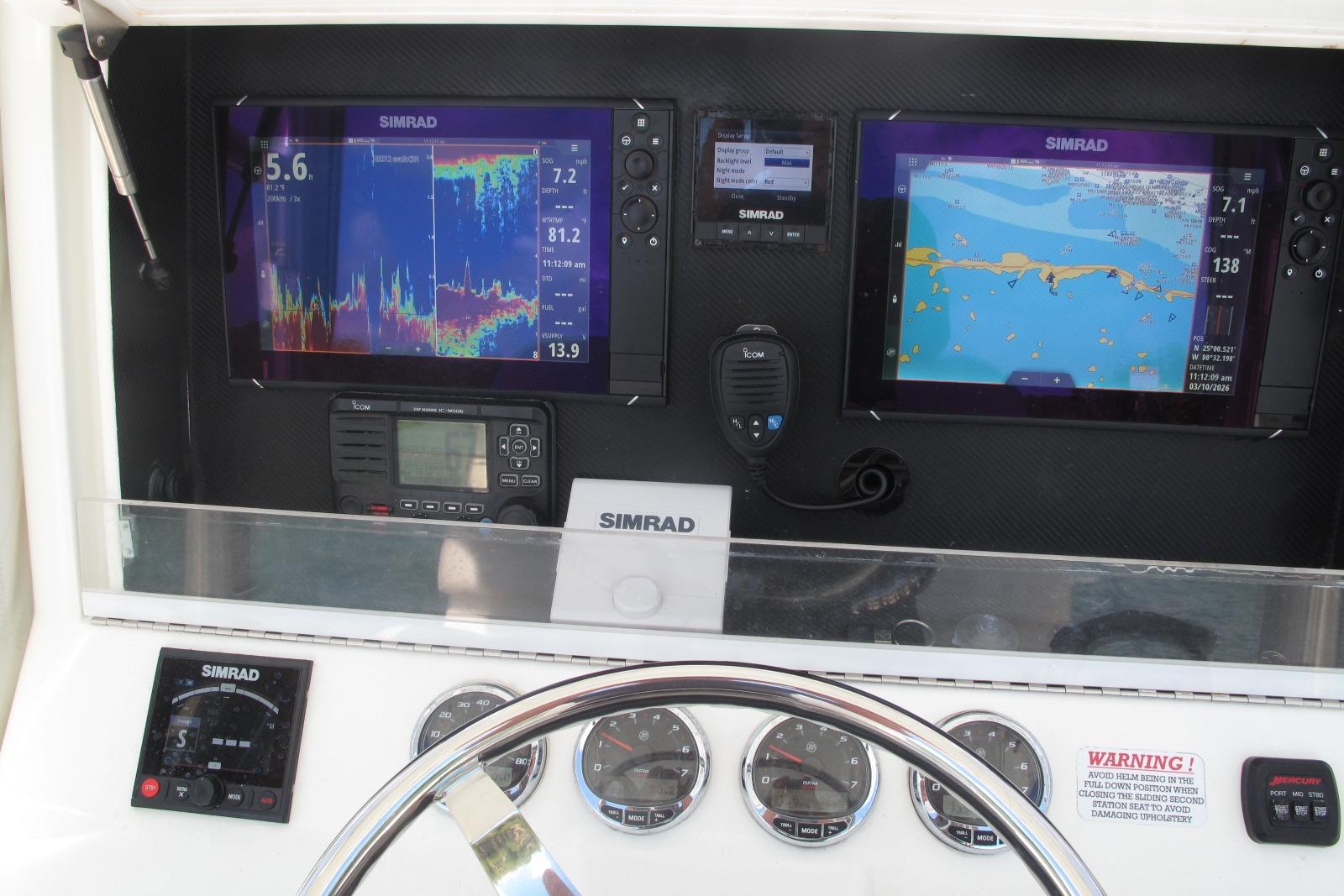 2017 SeaVee 340B boat dashboard with Simrad navigation and control systems.