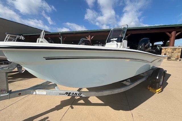 2026 Mako Pro Skiff 15 CC boat on trailer under blue sky.