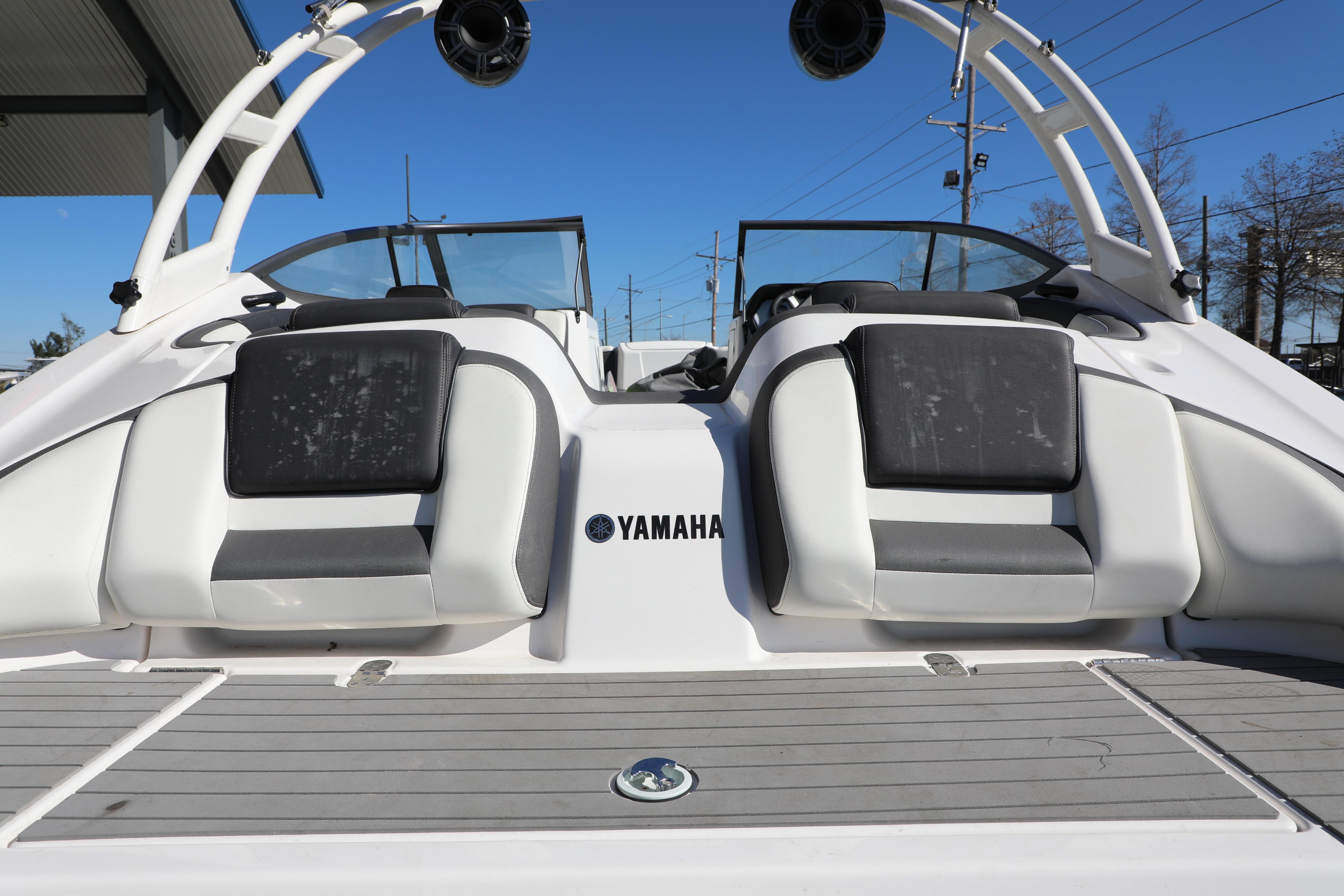 2022 Yamaha AR210 boat rear view with seating and speakers.