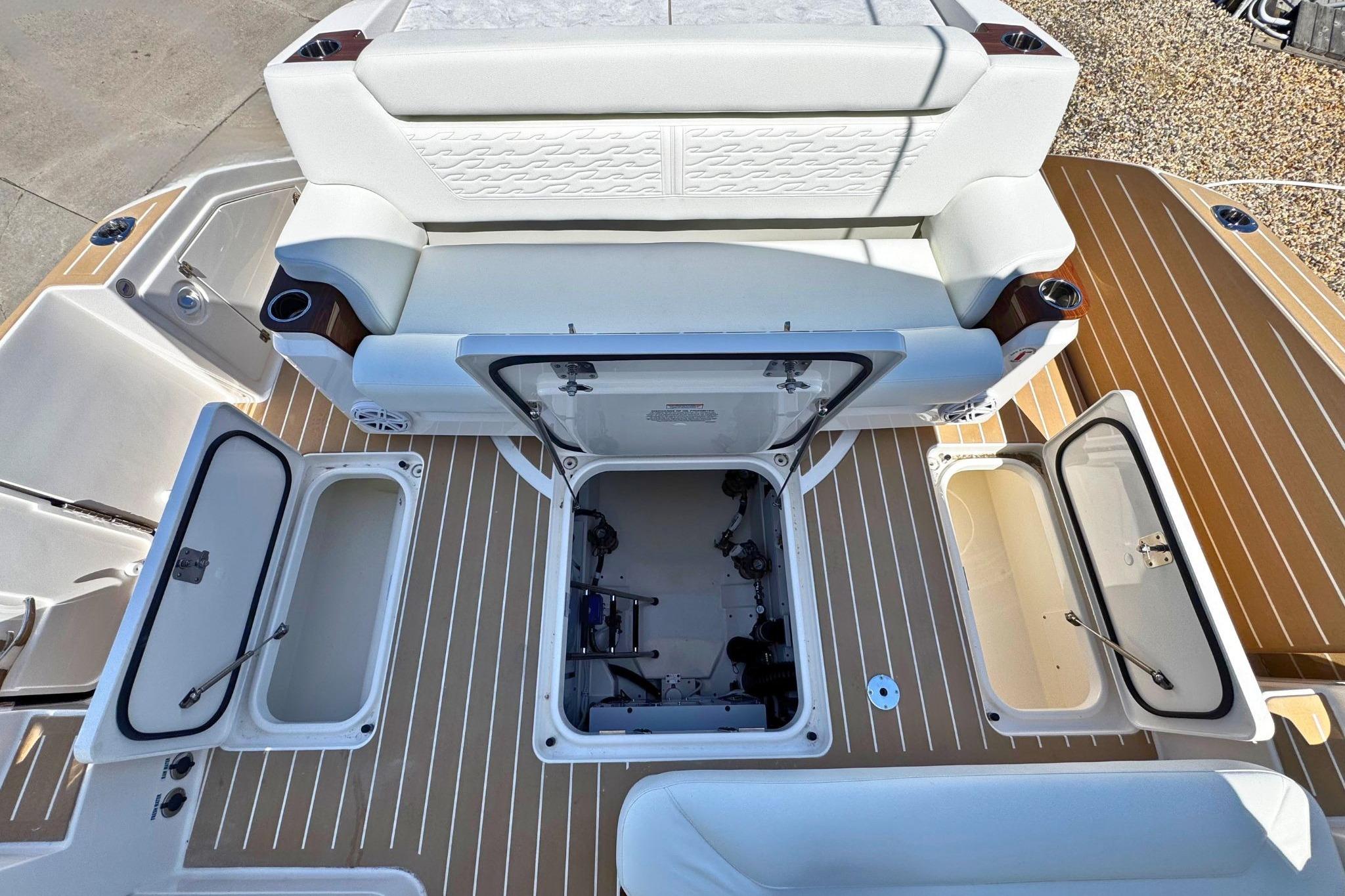 2027 Tiara Yachts 39 LE deck with open storage compartments and seating area.