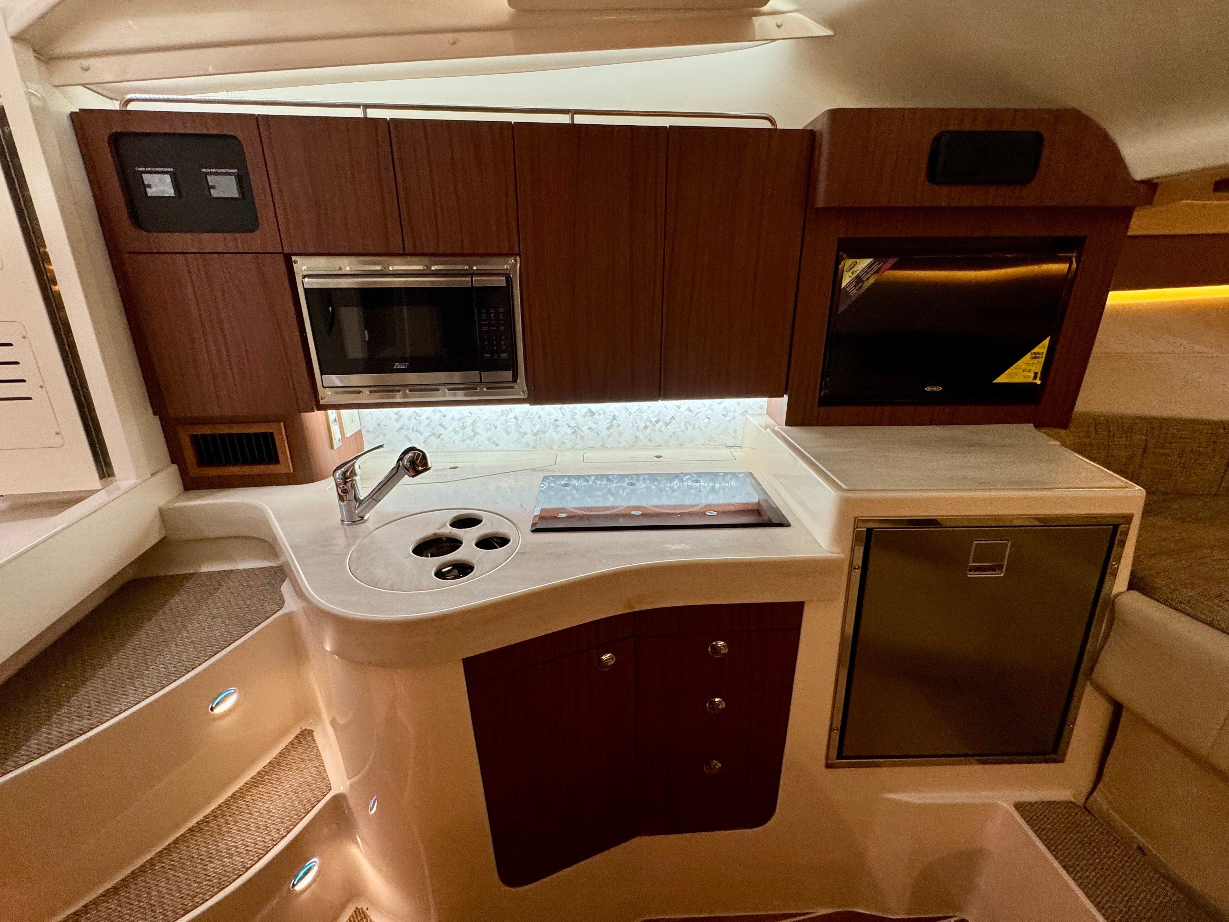 Interior of Grady-White Express 330 yacht kitchen, 2025 model.