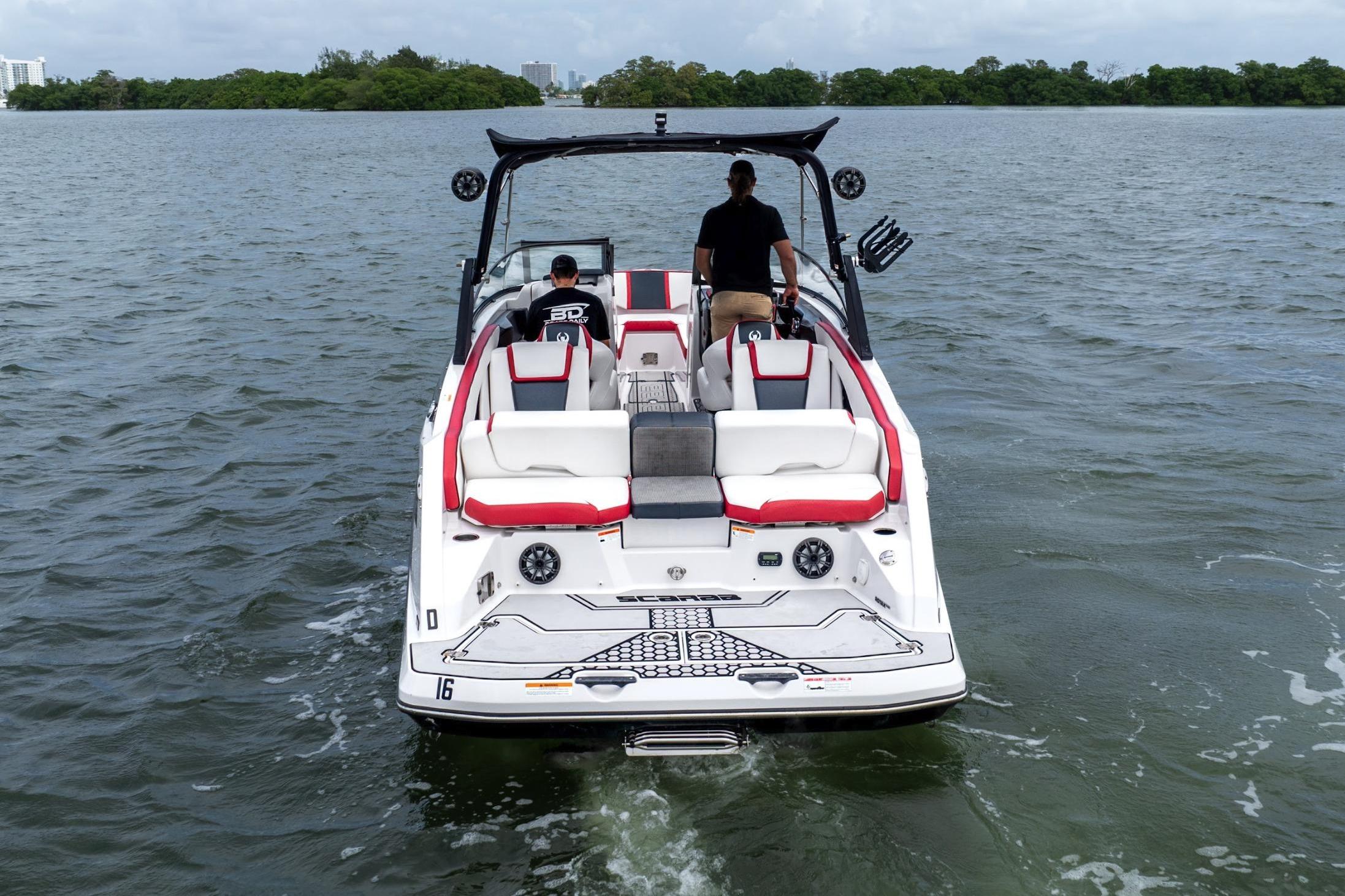 2017 Scarab 255 H.O. Impulse boat cruising on a calm lake.