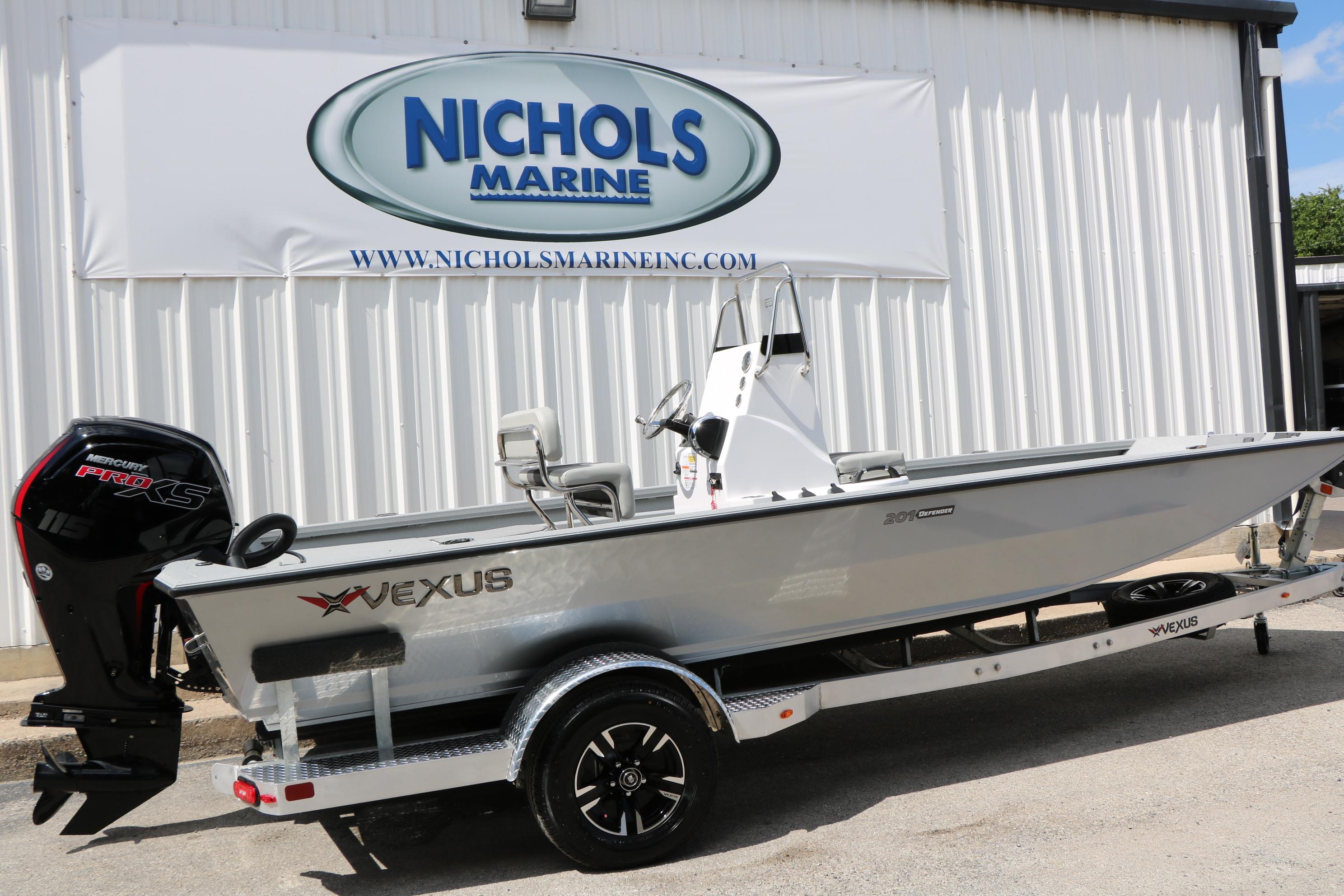 2026 Vexus Defender 201 boat on trailer at Nichols Marine dealership.
