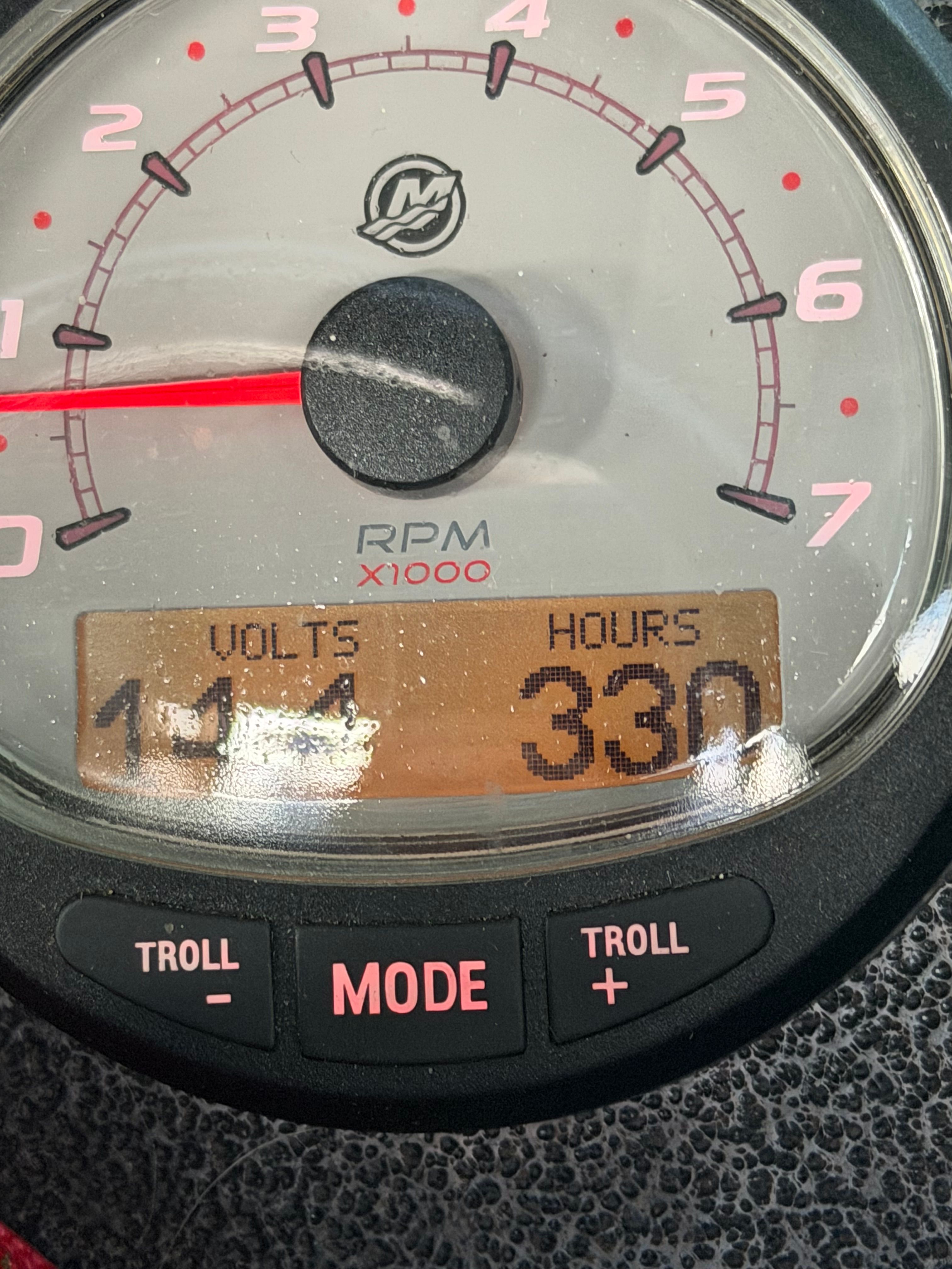 Tachometer of Alumaweld Pacific 27 boat, displaying 330 hours.