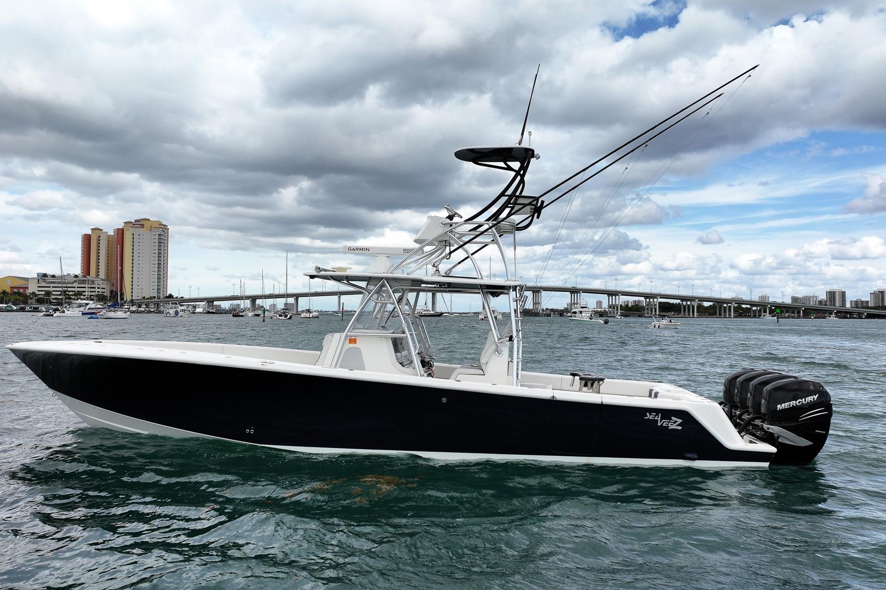 2022 SeaVee 390Z boat with Mercury engines on a scenic waterfront.
