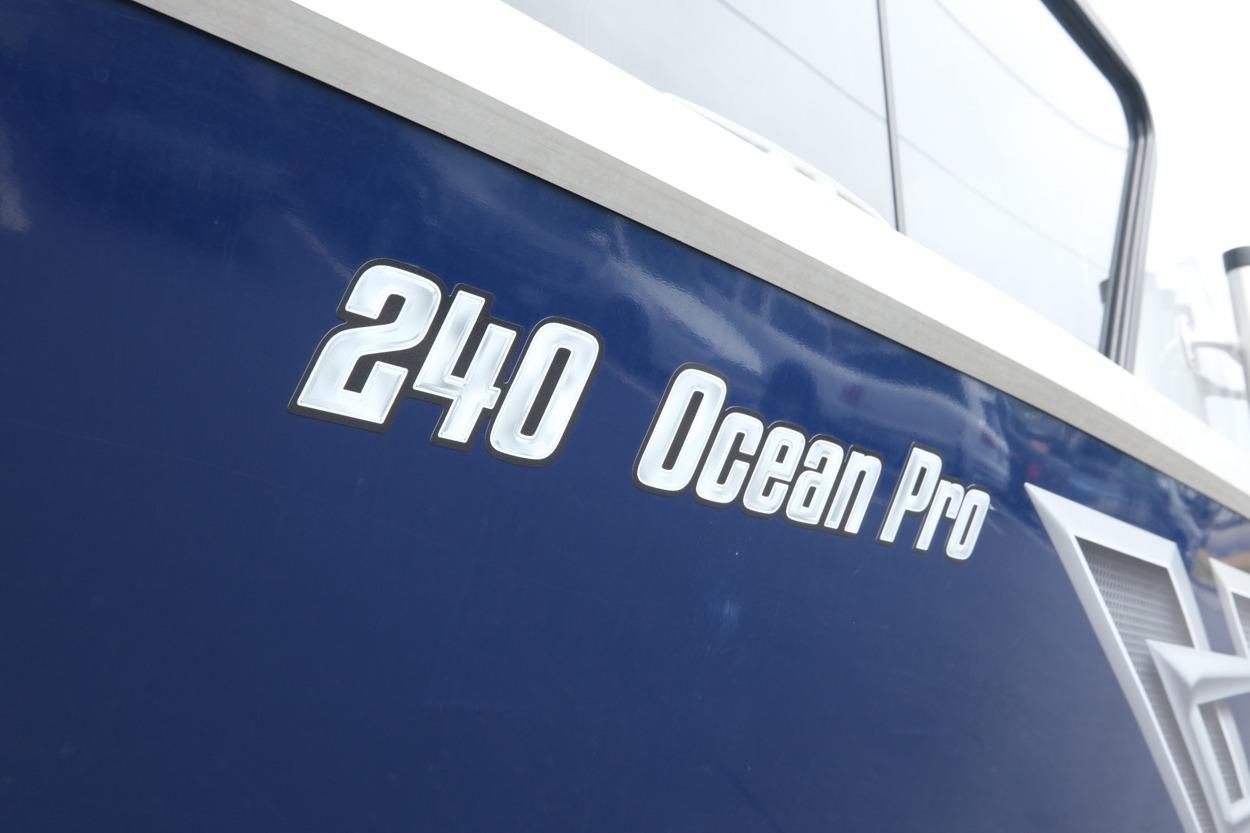 2021 Hewescraft 240 Ocean Pro ET Hardtop boat, blue exterior with model name displayed.