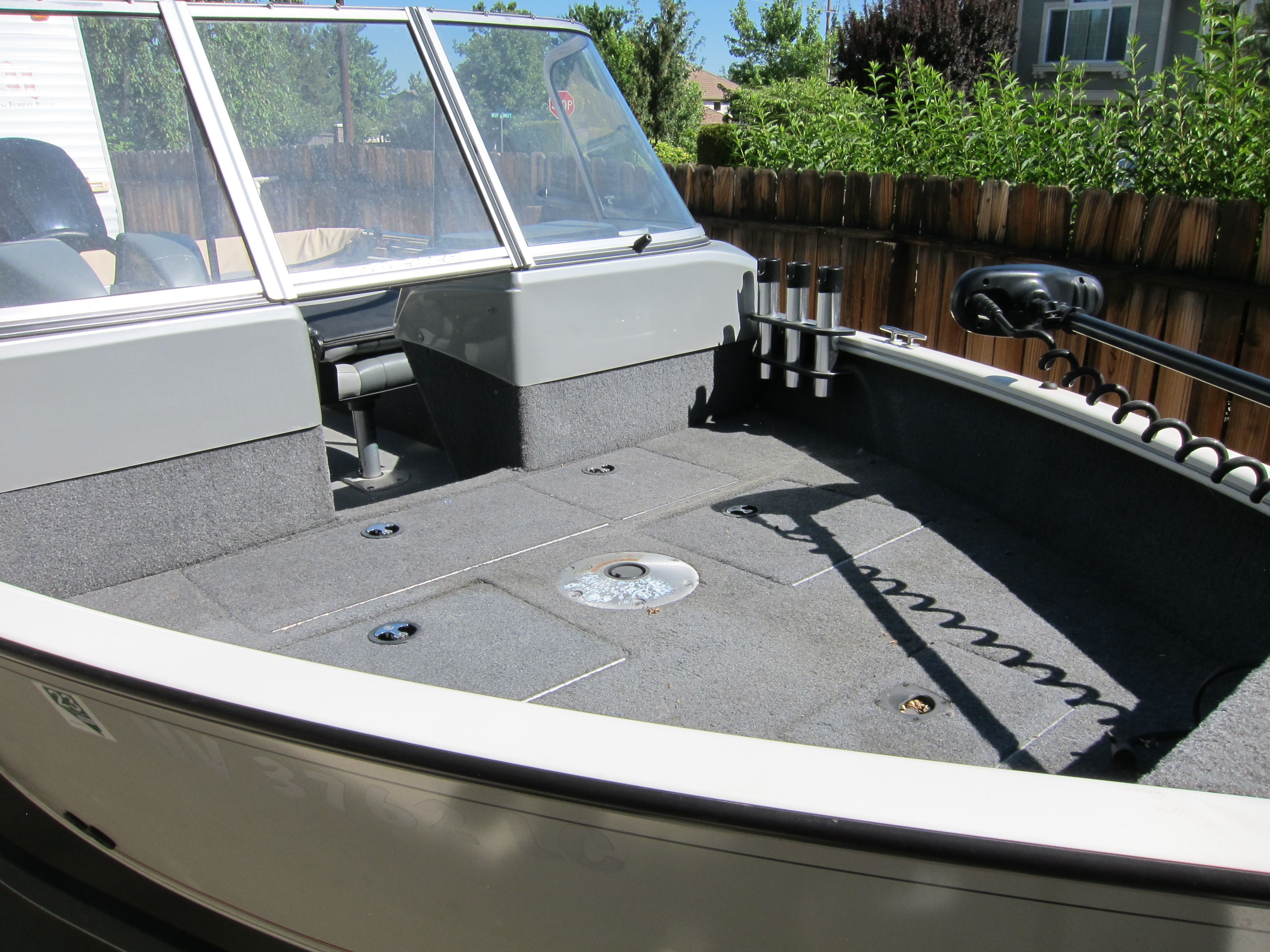 The image shows the deck of a 2018 Tracker Pro Guide V-16 WT boat.