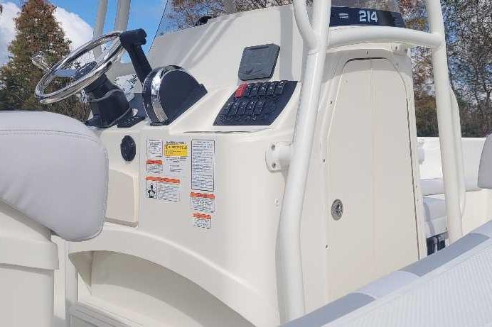 2026 Mako 214 Center Console boat dashboard with steering wheel and control panel.