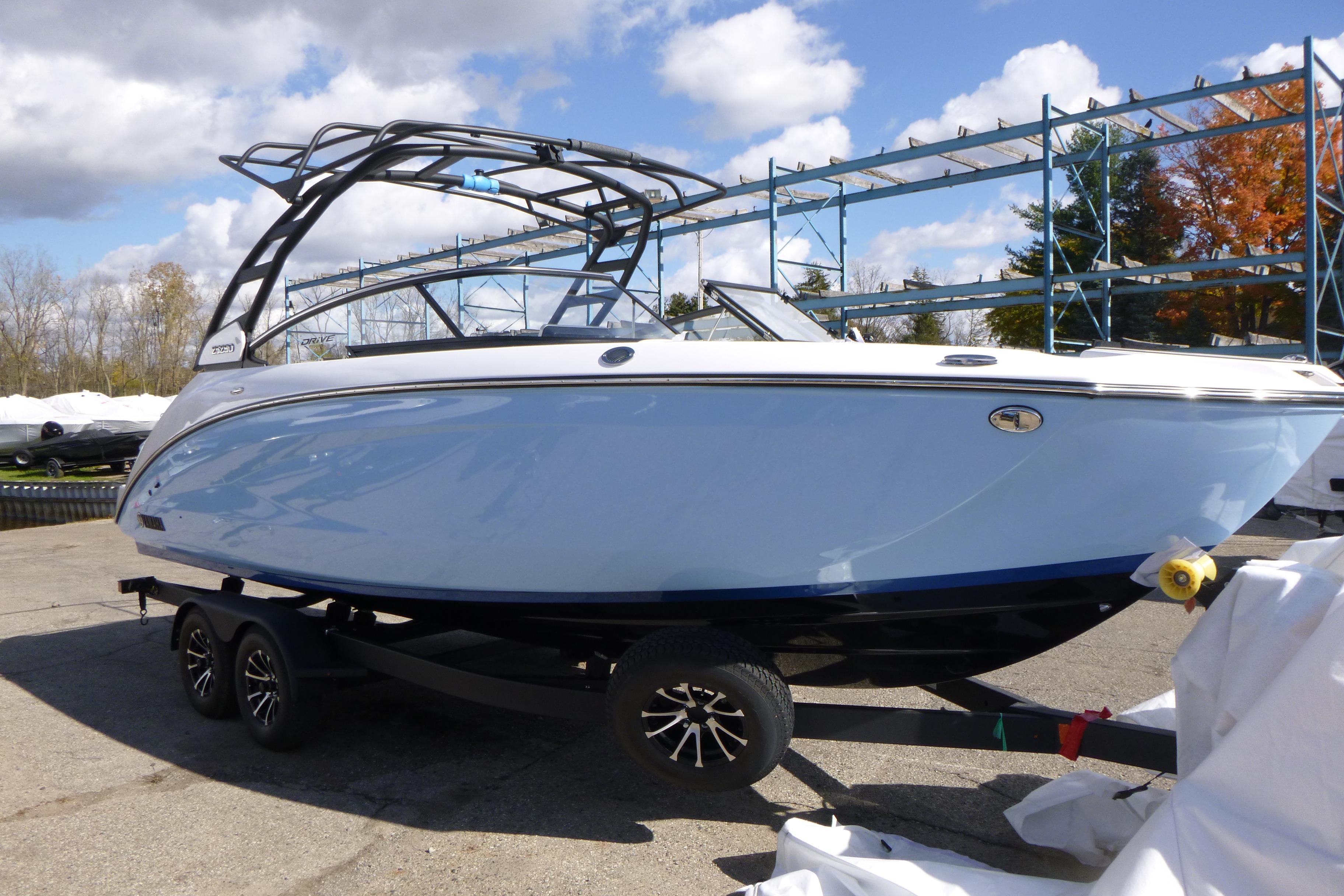 2026 Yamaha Boats 252SD on trailer, sleek design under blue sky.