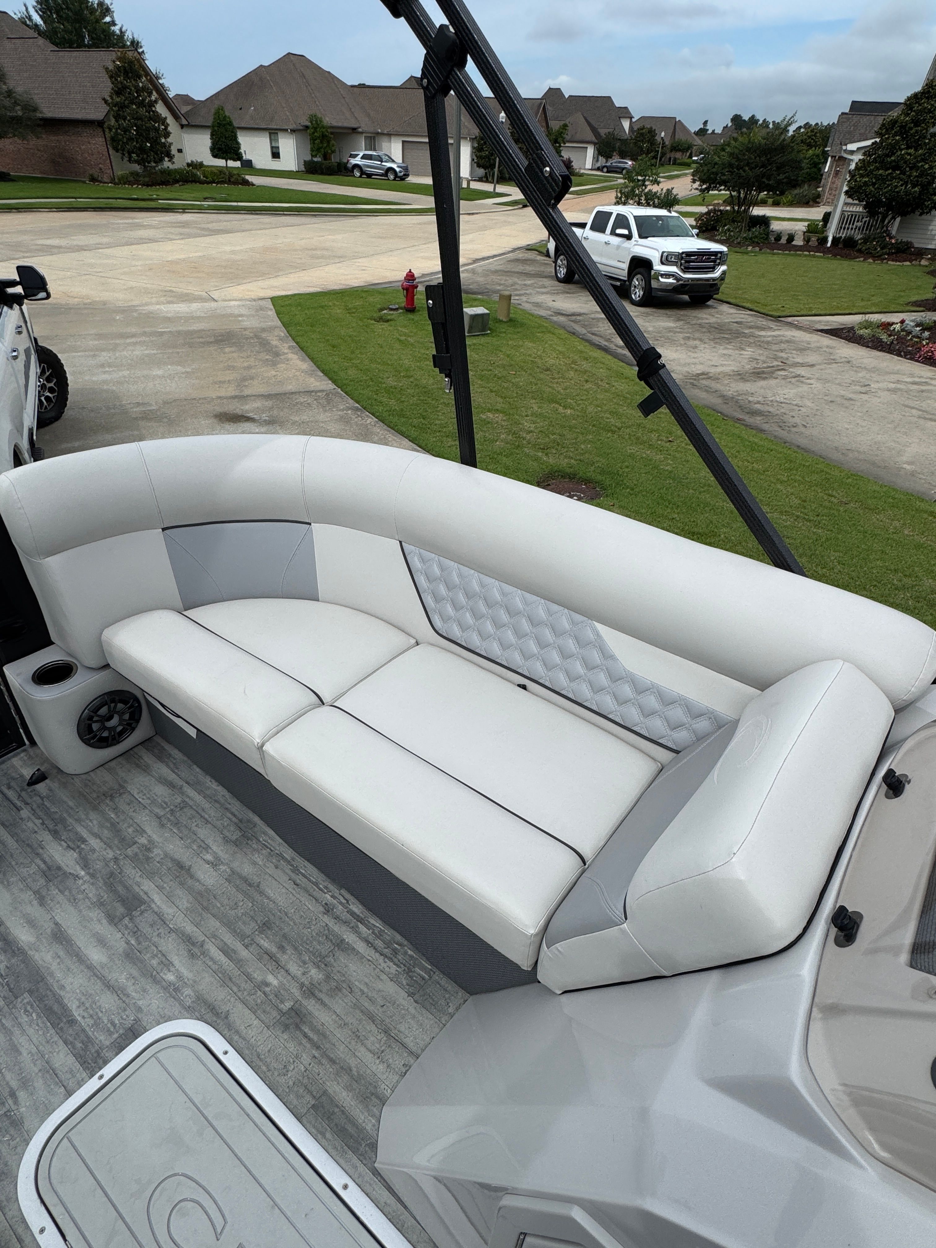Interior of a 2022 Crest Classic DLX 220 boat, white upholstery.