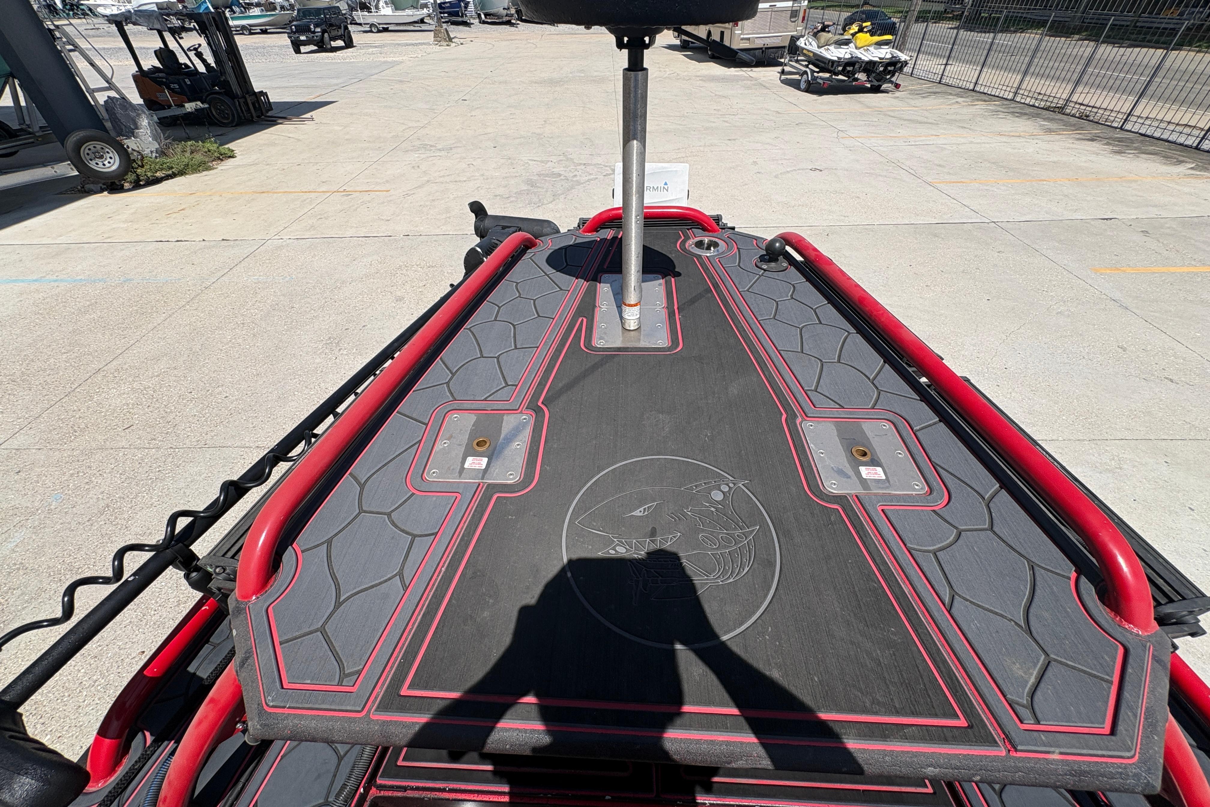 Custom 2018 Swamp Shark 24' boat deck with red accents and unique design.